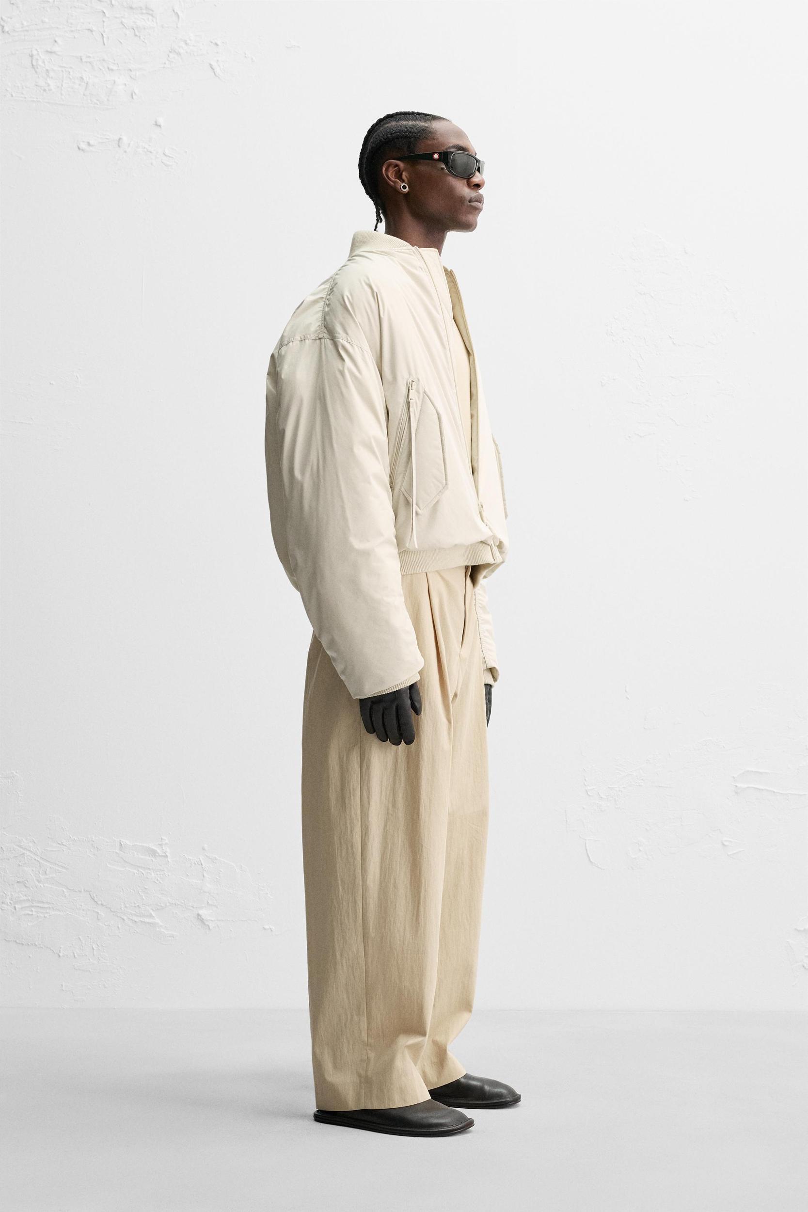 LIMITED EDITION RELAXED FIT PLEATED PANTS Product Image