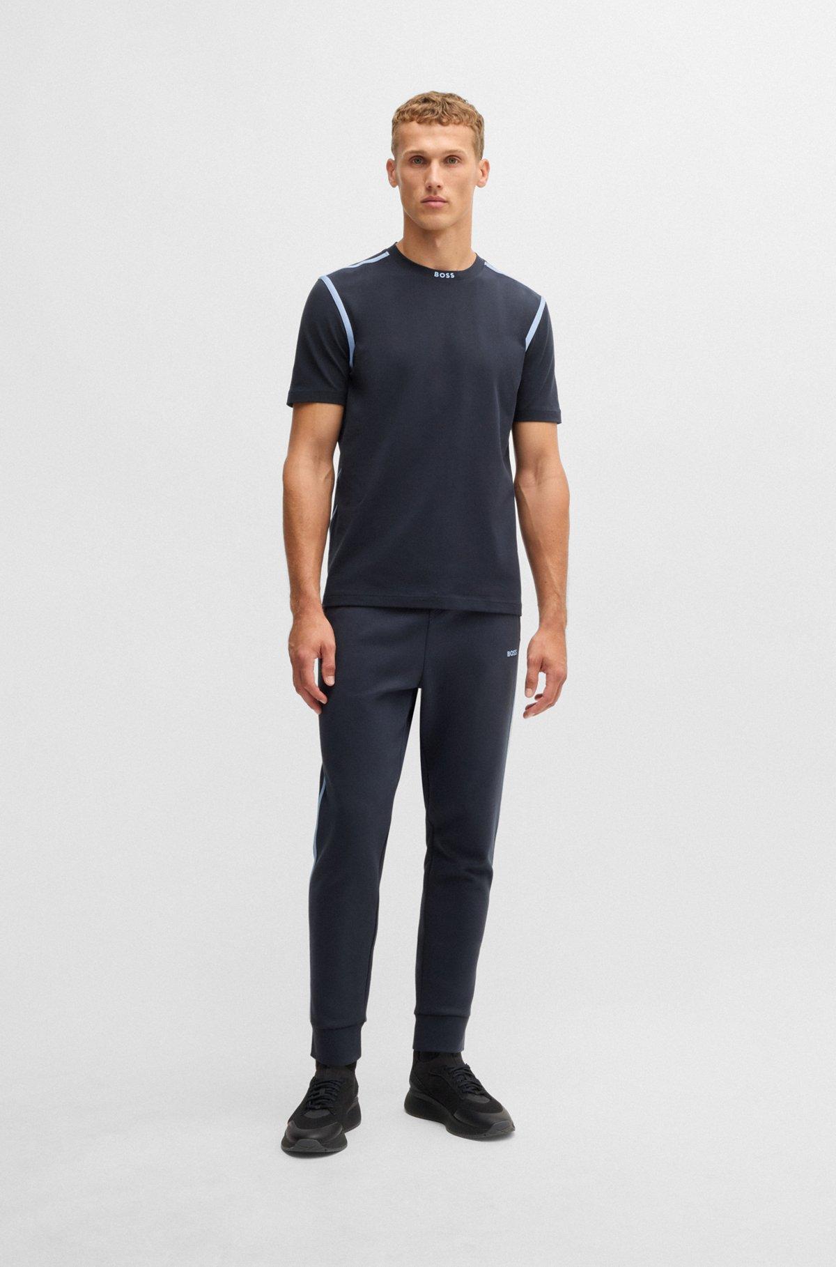 Tracksuit bottoms with tape and logo Product Image