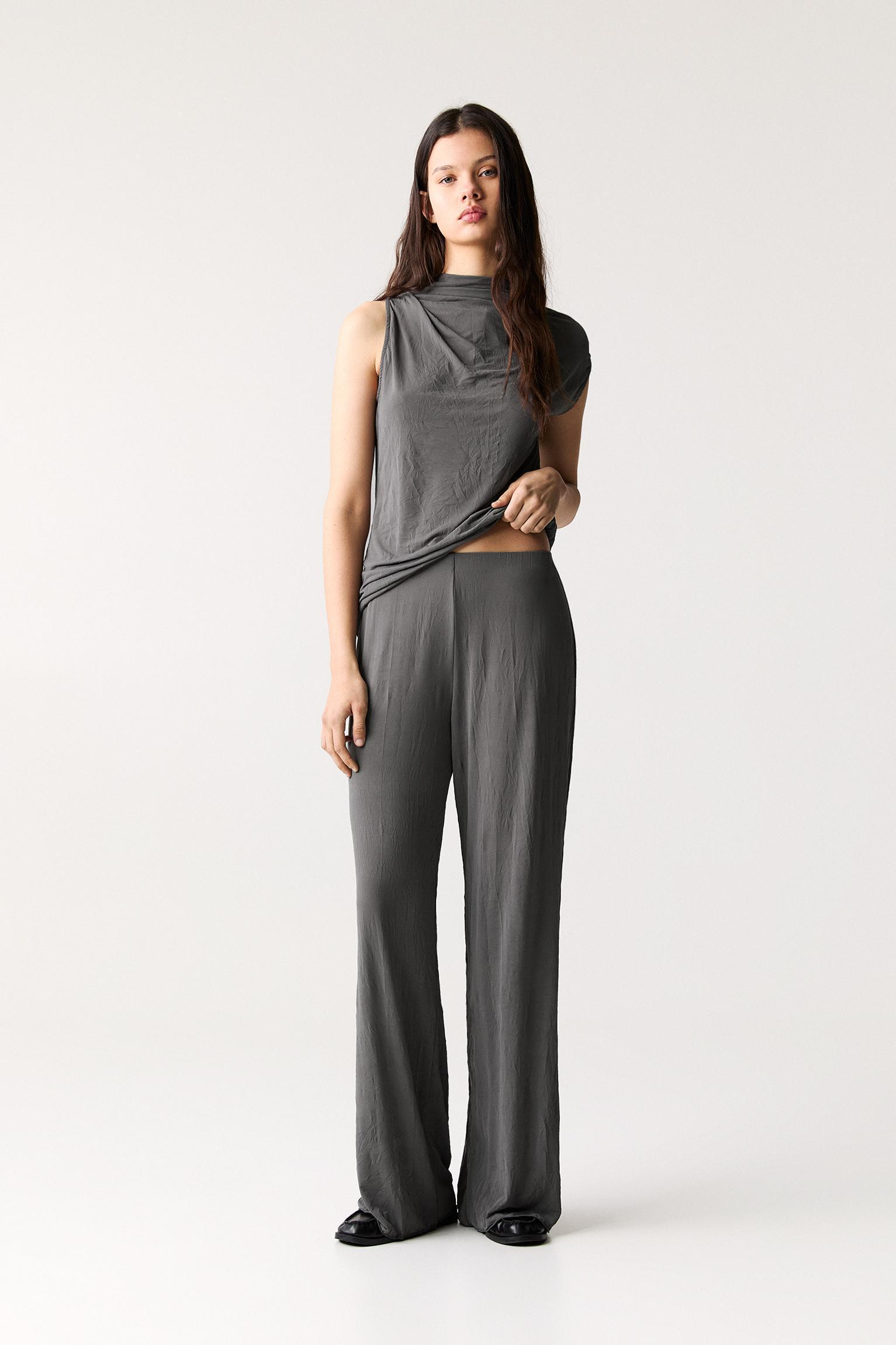 Creased-effect flared pants Product Image