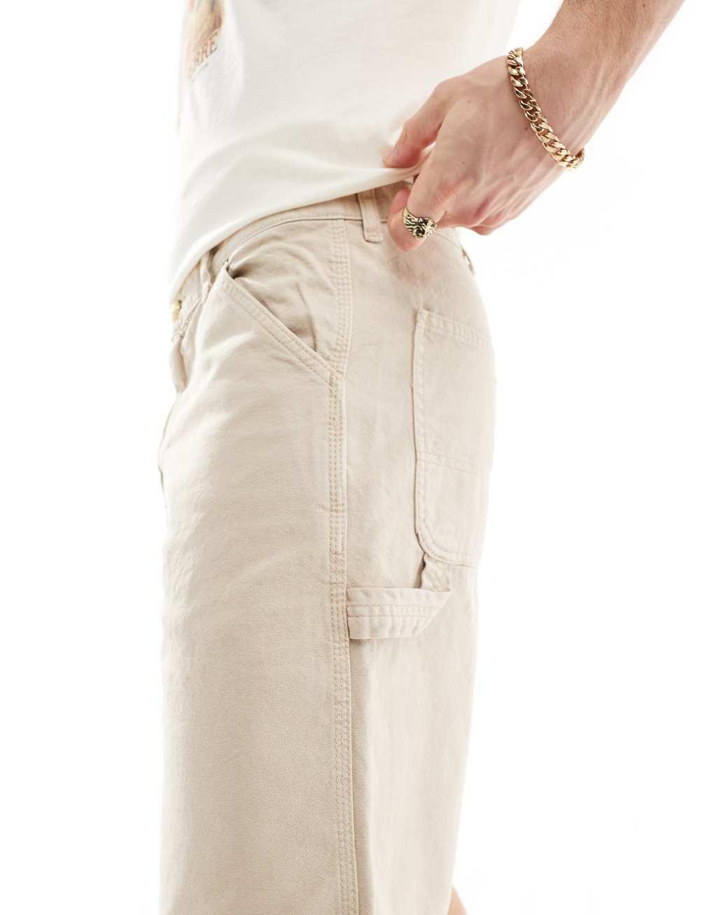 Jack & Jones baggy fit carpenter shorts in beige Product Image