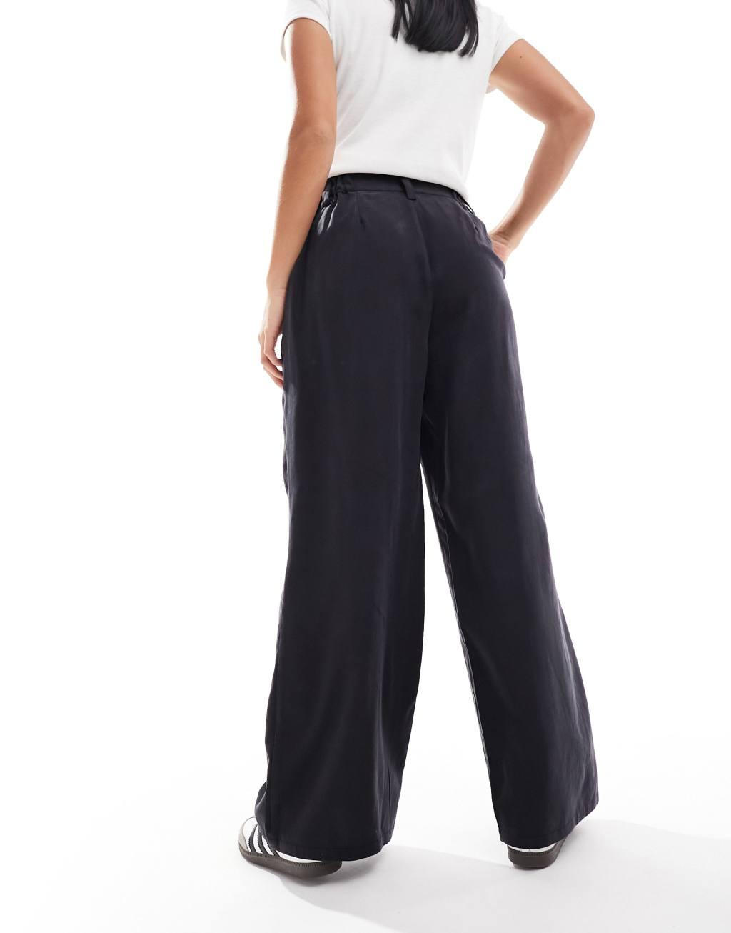 ASOS DESIGN Petite relaxed straight leg pants in washed black Product Image