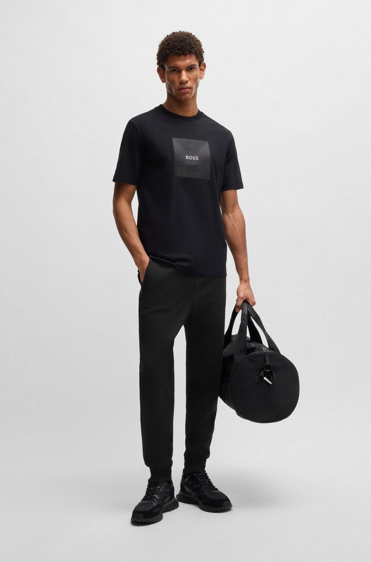 Stretch tracksuit bottoms with logo patch Product Image