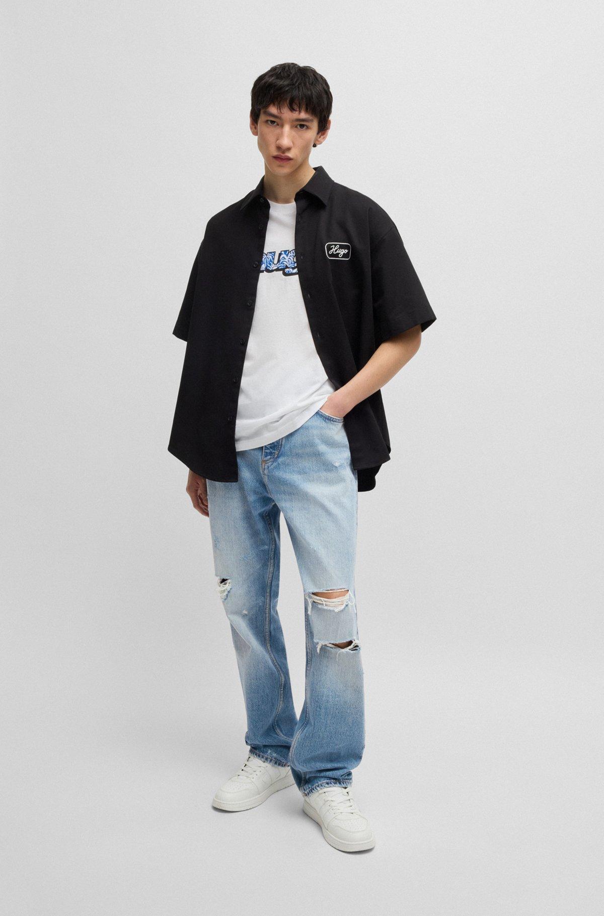 Baggy-fit jeans in stonewashed blue denim Product Image