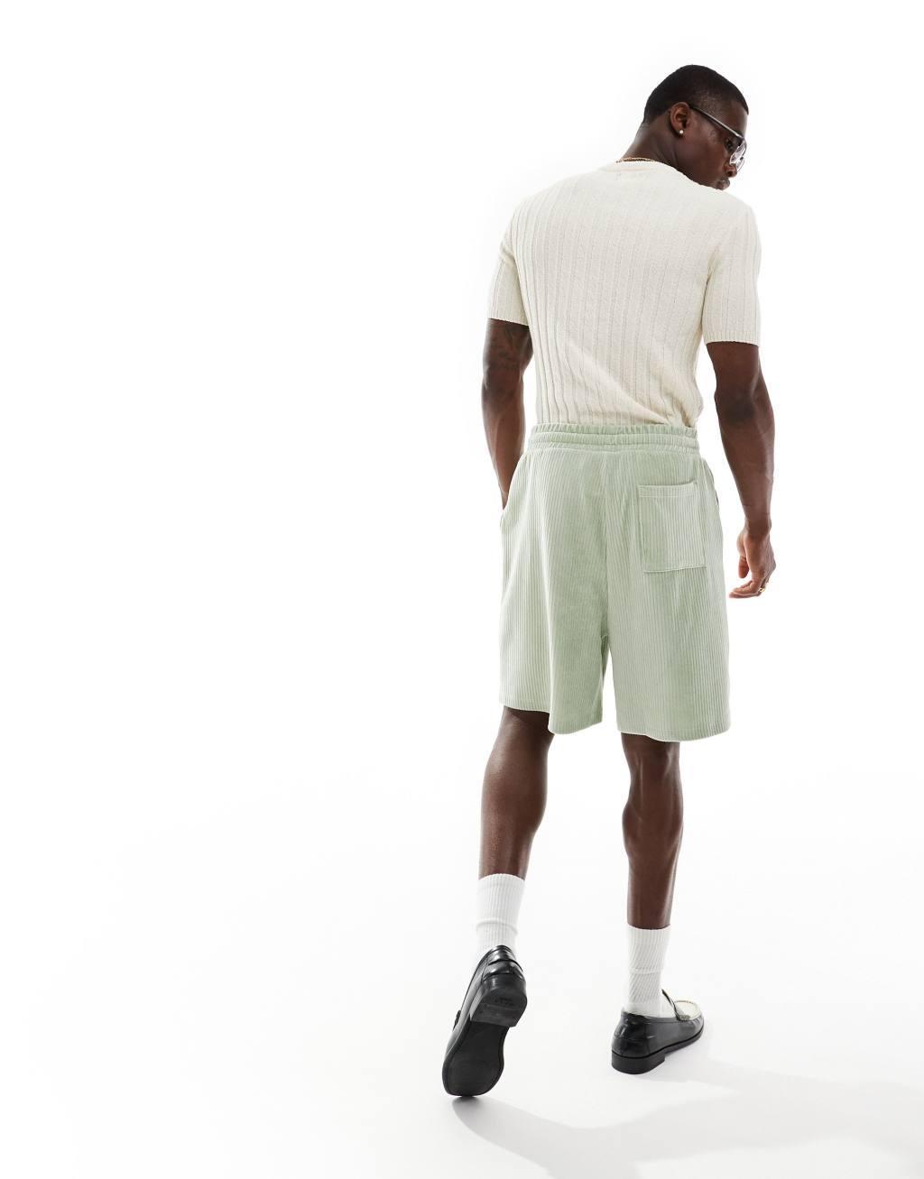 ASOS DESIGN oversized ribbed velour shorts in light green Product Image