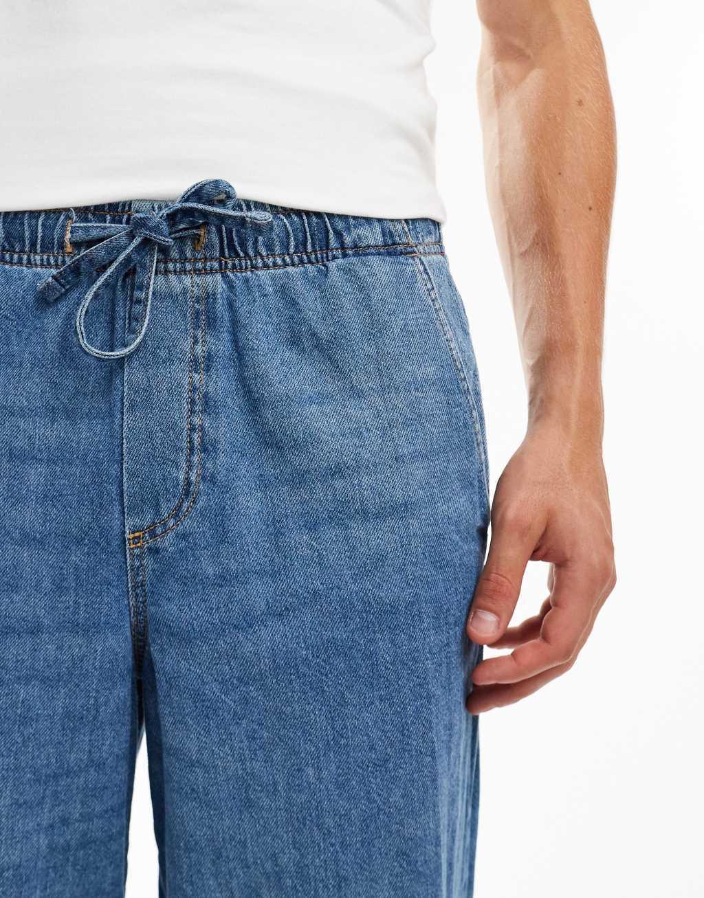 Jack & Jones Eddie loose drawstring jeans in mid blue wash Product Image