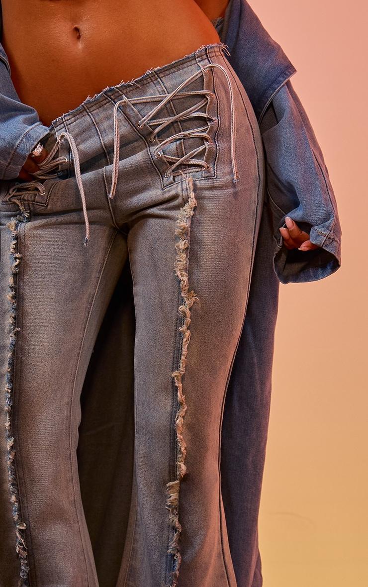 Light Blue Vintage Wash Front Frayed Seam Lace Up Detail Flared Jeans Product Image