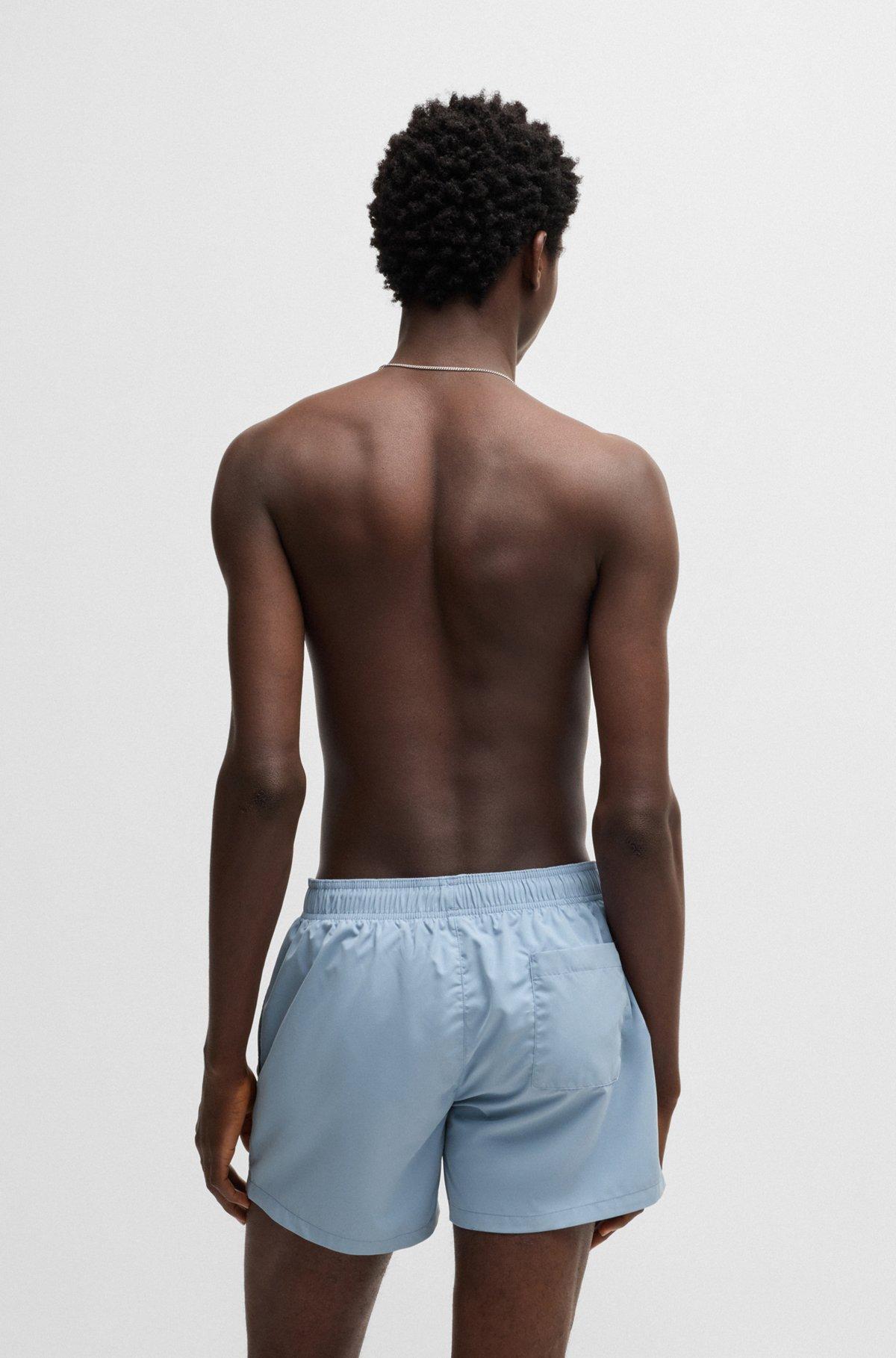 Quick-dry swim shorts with vertical logo print Product Image