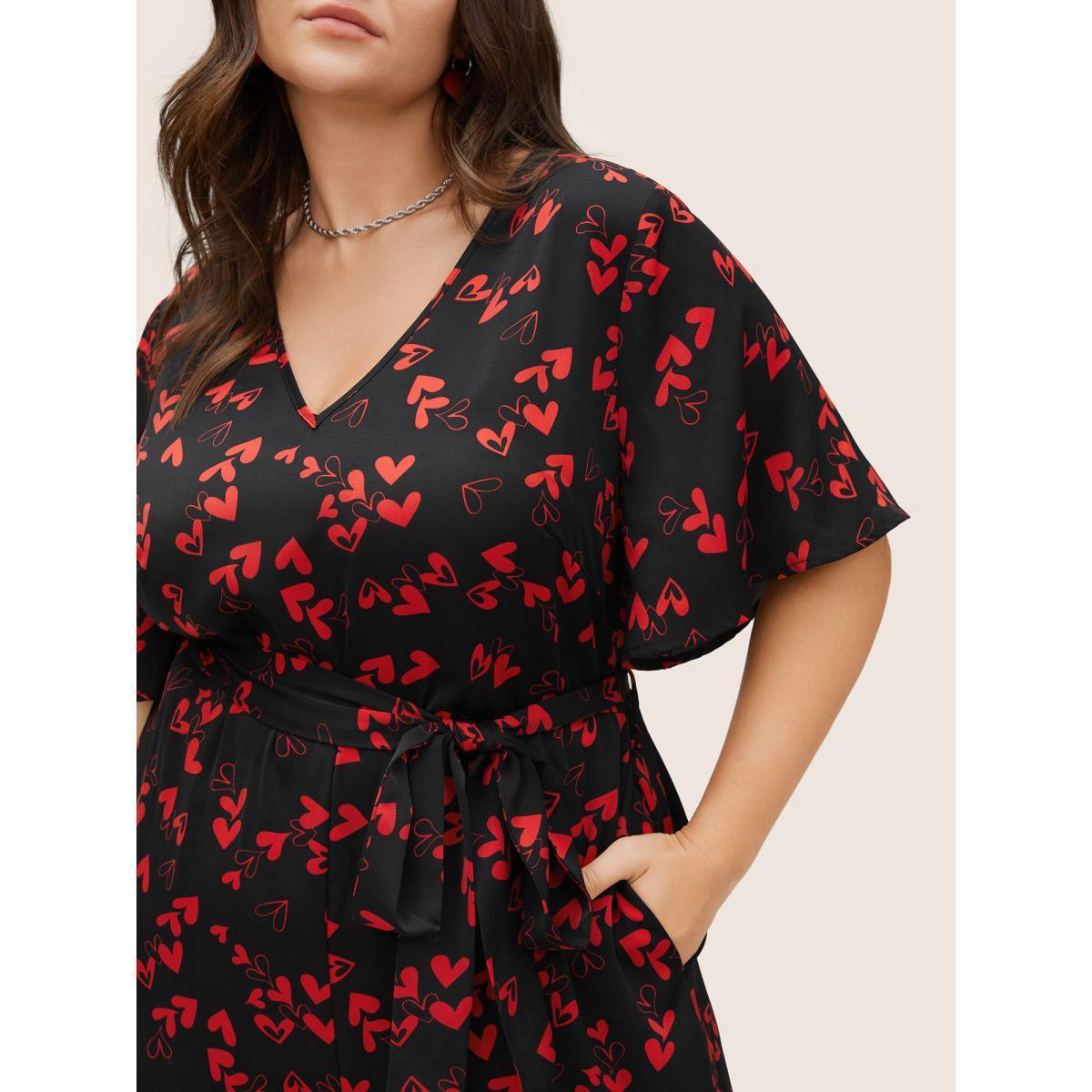 Plus Size Black Heart Print Pocket Belted Jumpsuit Women Elegant Short sleeve V-neck Everyday Loose Jumpsuits BloomChic 26/4X Product Image