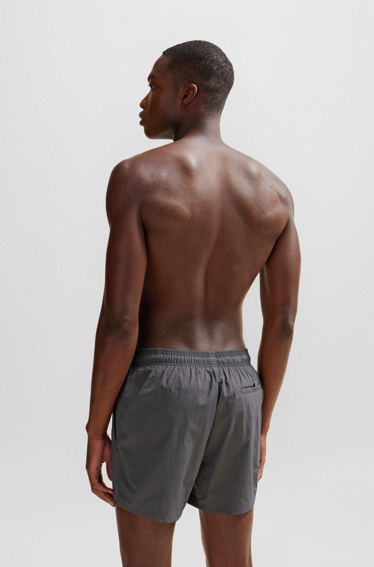 Quick-dry swim shorts with large logo print Product Image