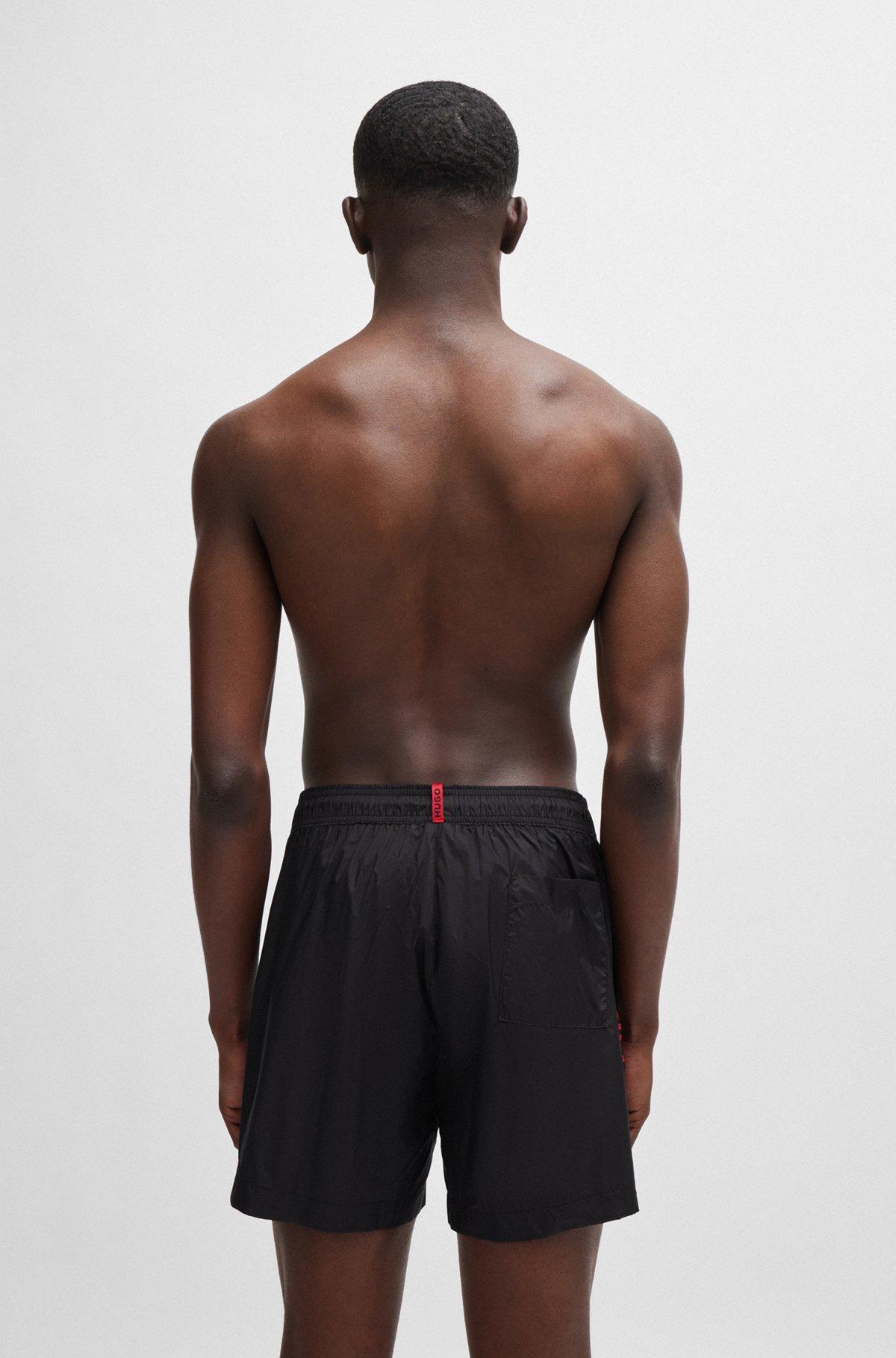 Fully lined swim shorts with logo tape Product Image