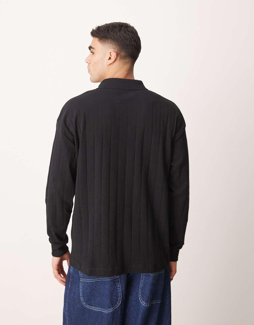 ASOS DESIGN oversized long sleeve textured ribbed polo with camp collar in black Product Image