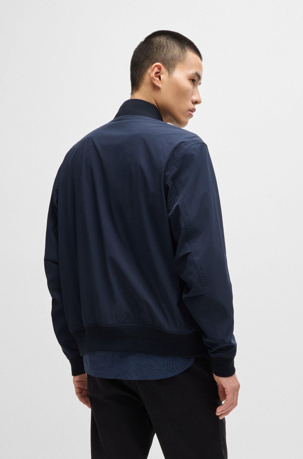 Water-repellent jacket with zipped sleeve pocket Product Image