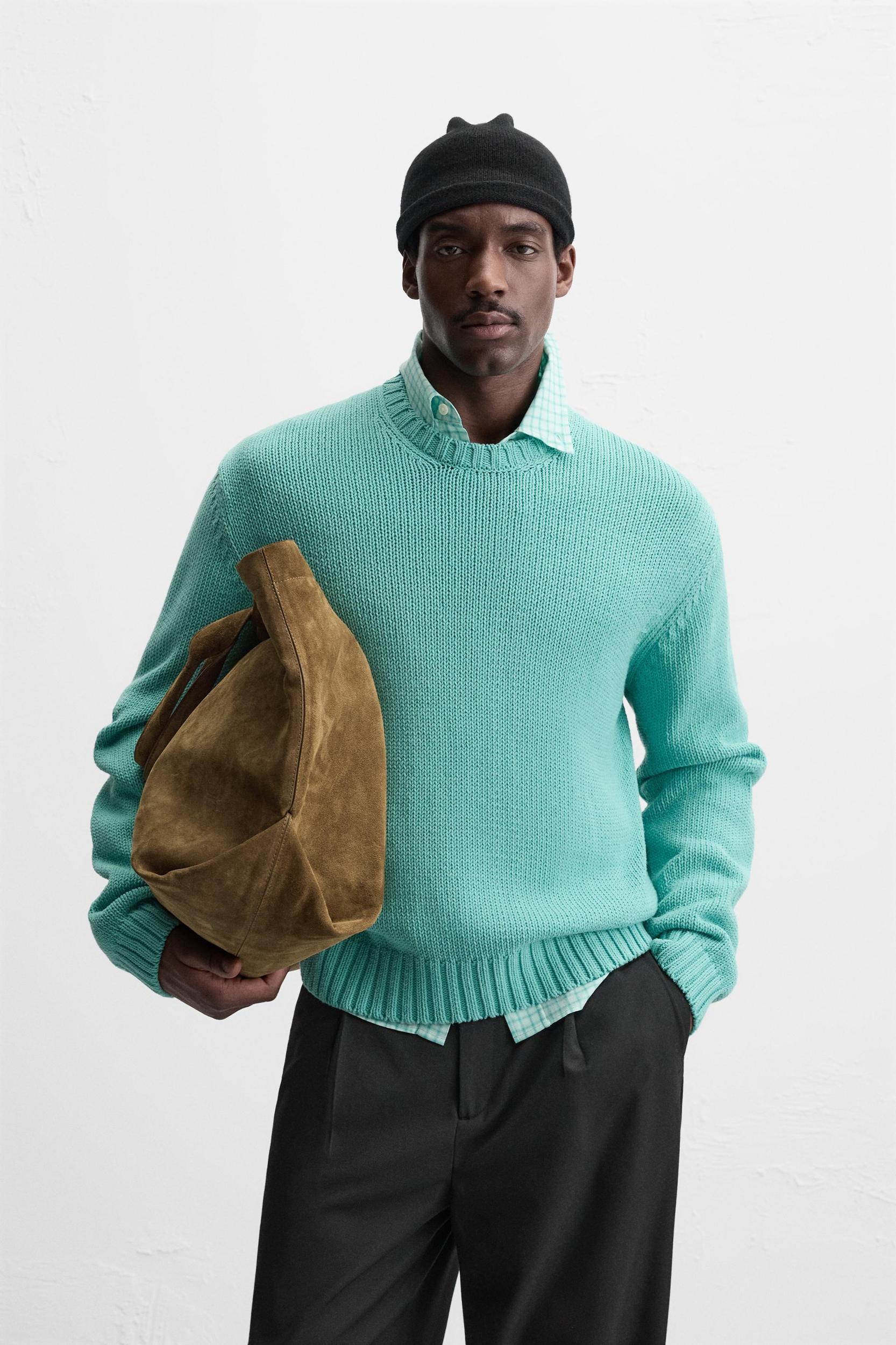 Relaxed fit cotton blend sweater. Round neck and long sleeves. Rib trim. Product Image
