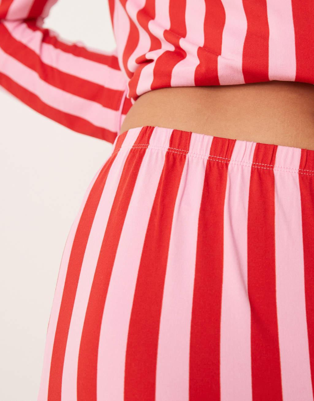 Urban Threads Christmas poly long sleeve revere and pants pajama set in pink and red stripe print Product Image