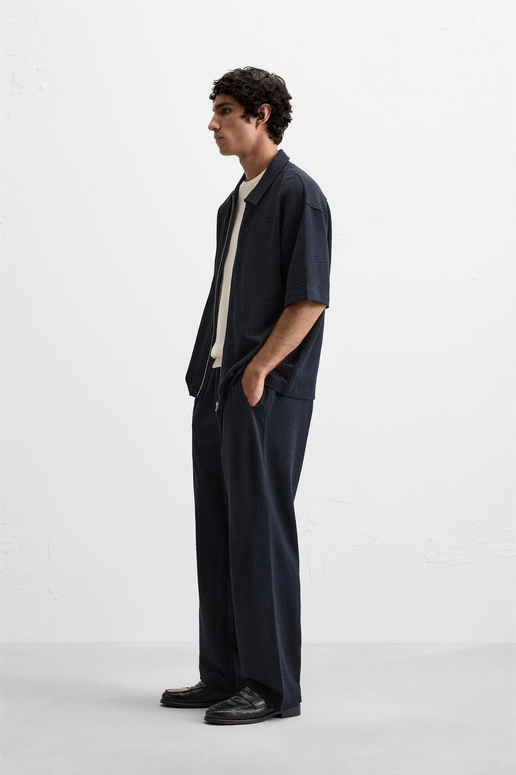 PLEATED SEERSUCKER PANTS Product Image