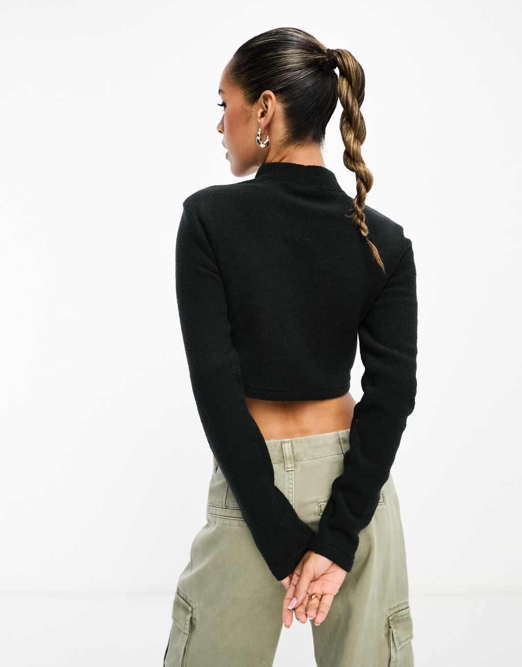 Nike Mini Swoosh Plush long sleeve top in black Product Image