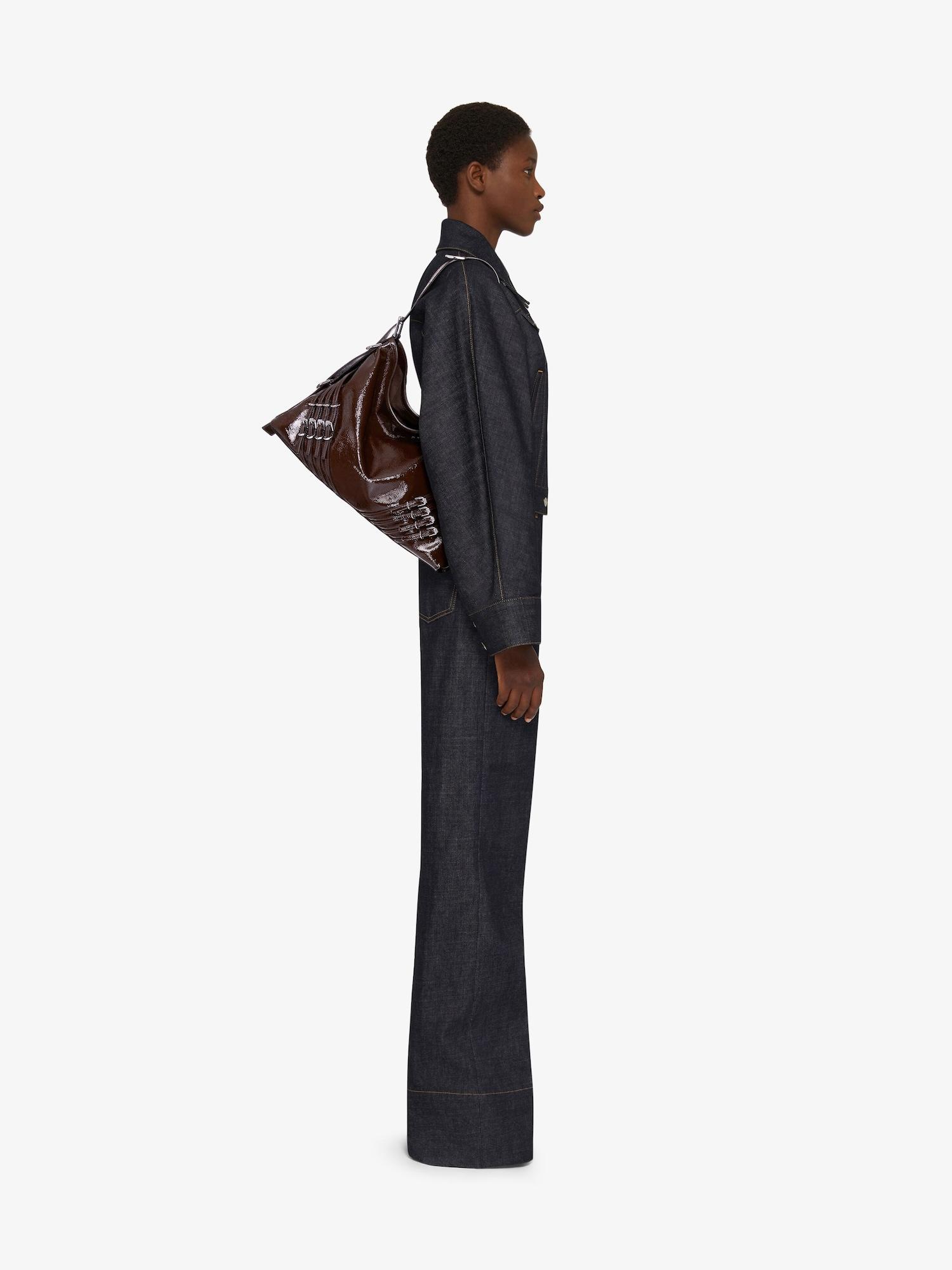Medium Voyou bag in patent leather with multi-buckles Product Image