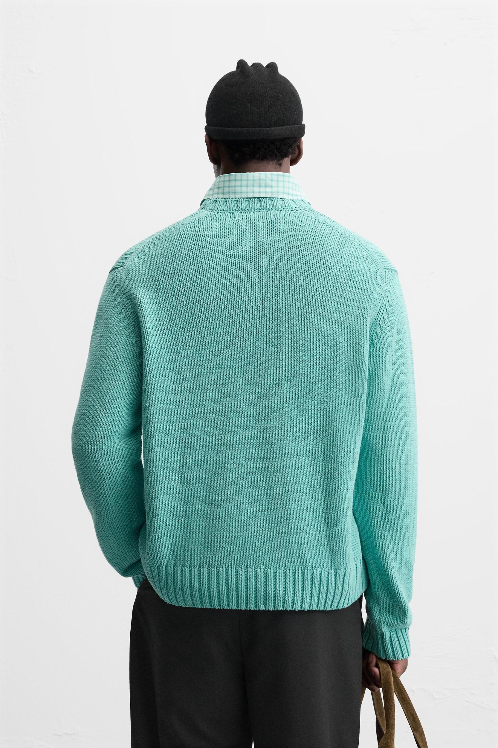 Relaxed fit cotton blend sweater. Round neck and long sleeves. Rib trim. Product Image