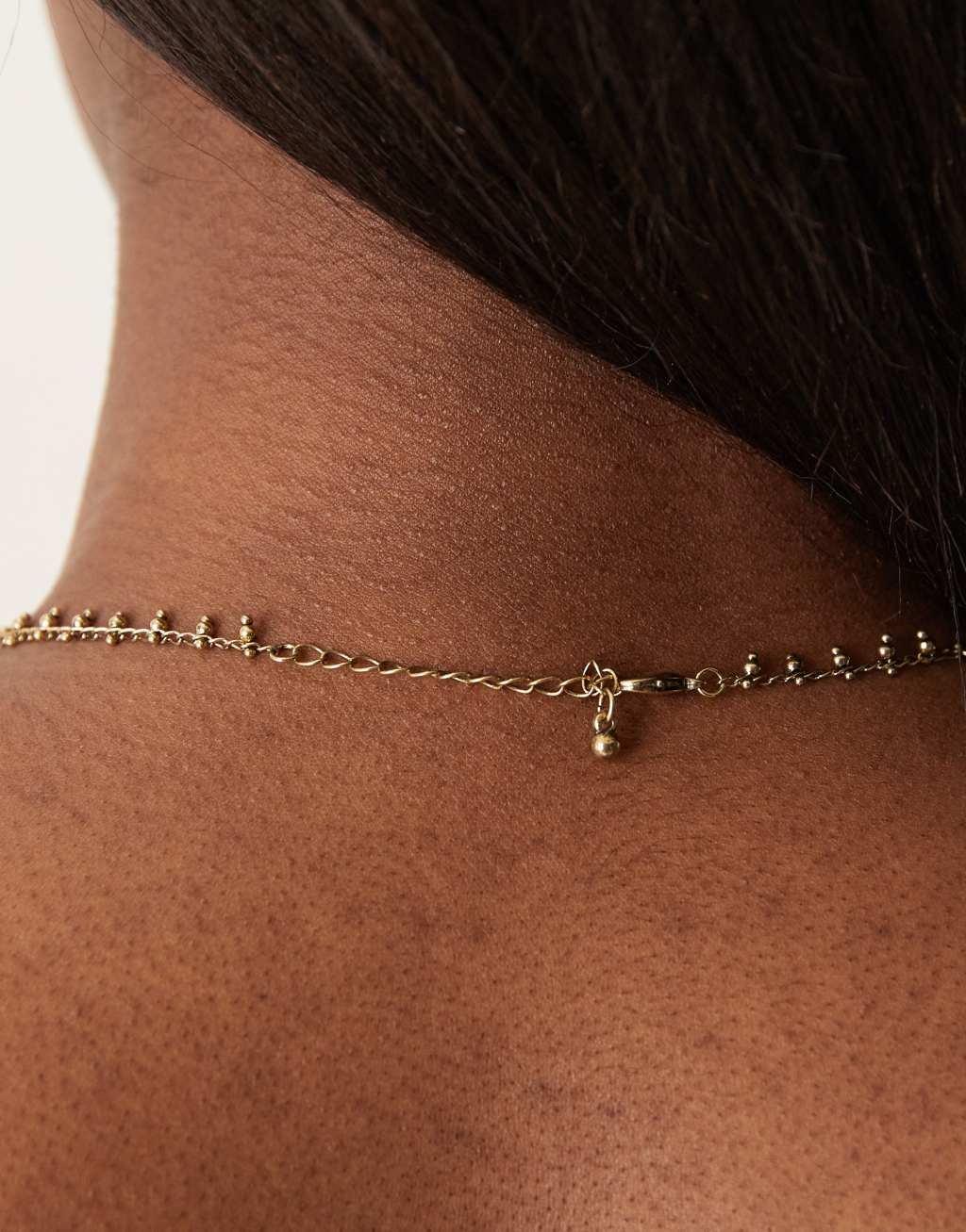 ASOS DESIGN necklace with faux quartz pendant in gold tone Product Image