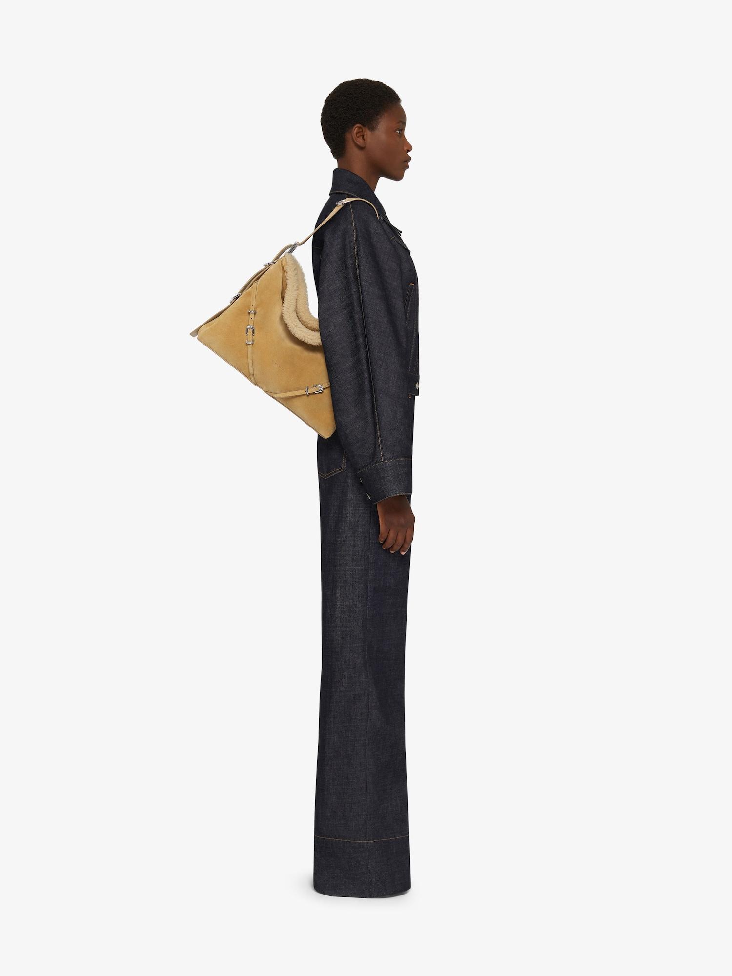 Medium Voyou bag in suede and shearling Product Image