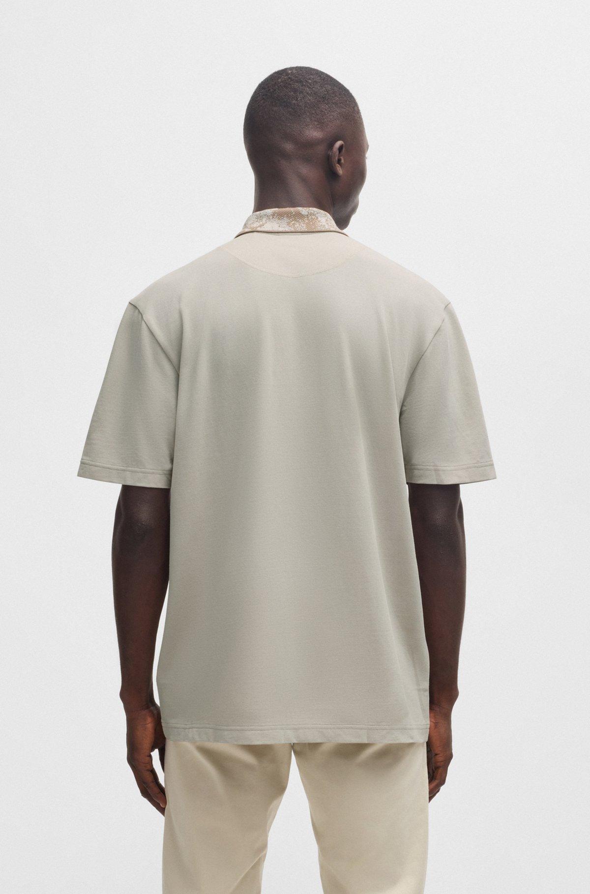 Cotton-piqué polo shirt with jungle-artwork collar Product Image
