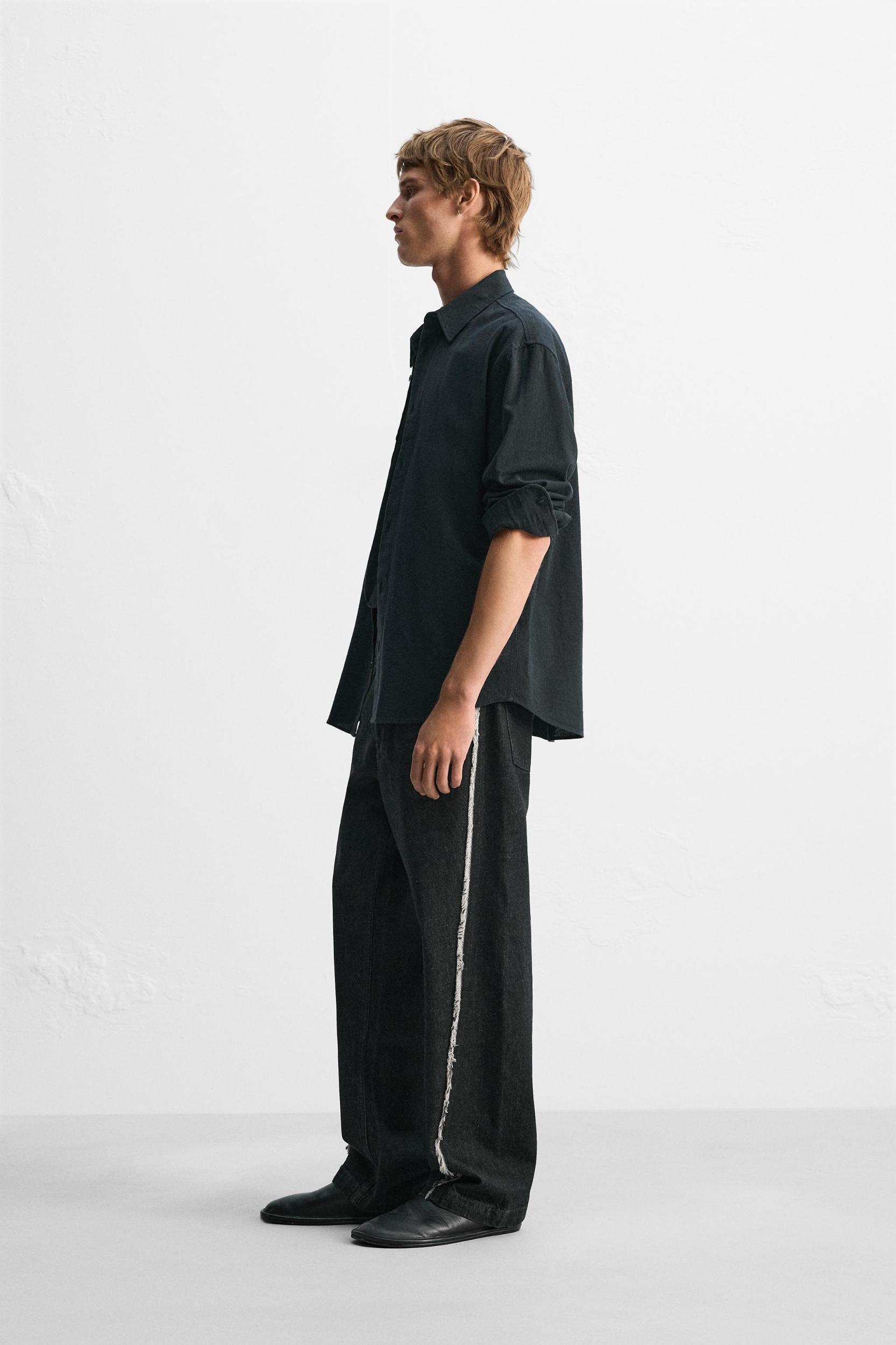 RELAXED FIT FRAYED SEAM JEANS Product Image