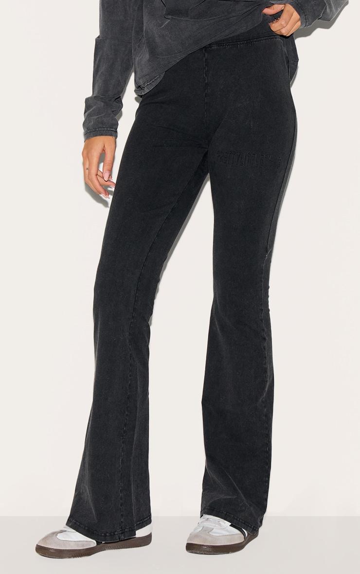 PRETTYLITTLETHING Black Embossed Logo Washed Skinny Flare Pants Product Image