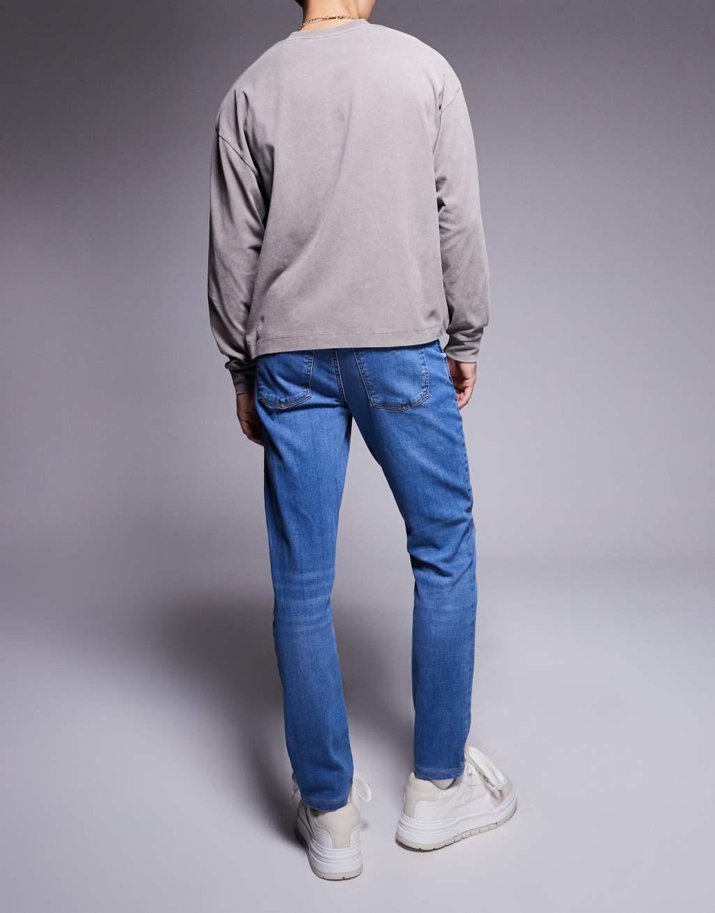 River Island slim fit jeans in medium blue Product Image