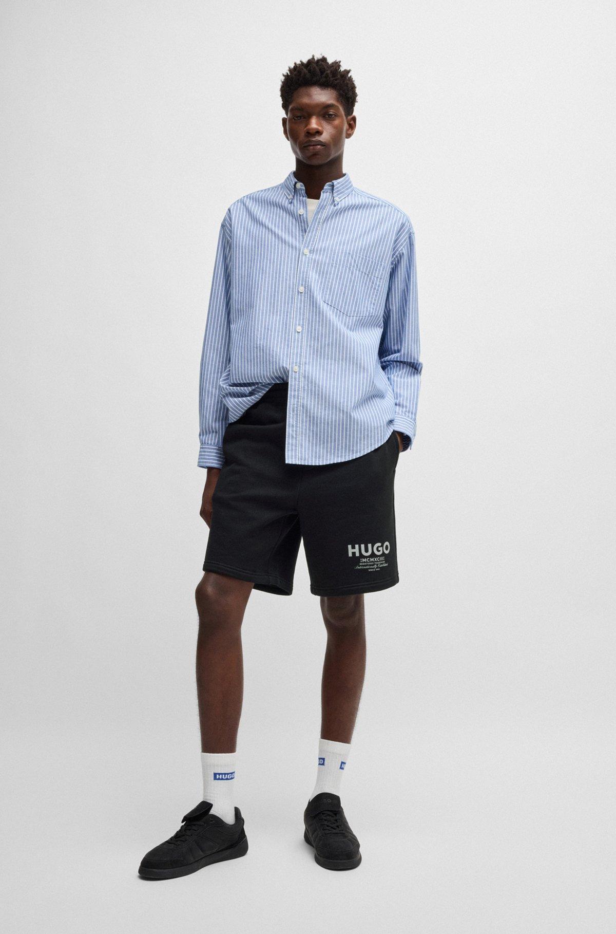 Loose-fit shorts in cotton terry with logo print Product Image