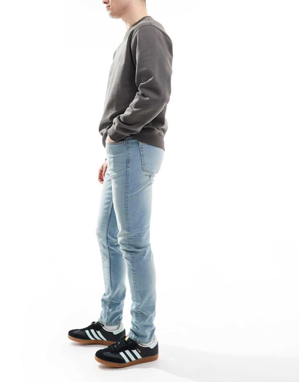 ASOS DESIGN skinny jeans in light wash blue with tint  Product Image