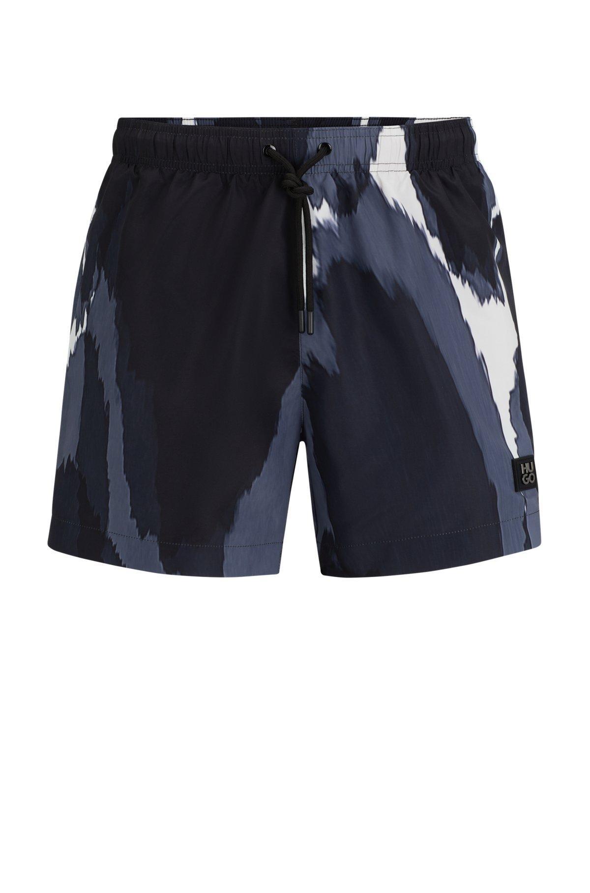 Seasonal-print quick-dry swim shorts with metallic logo Product Image