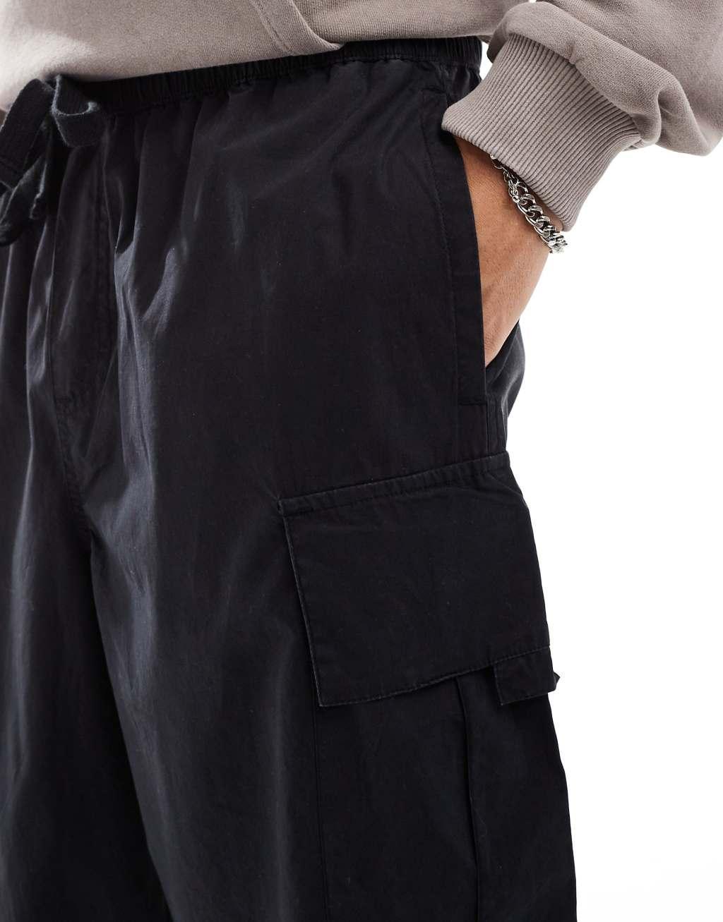 Another Influence wide leg parachute cargo pants in black Product Image