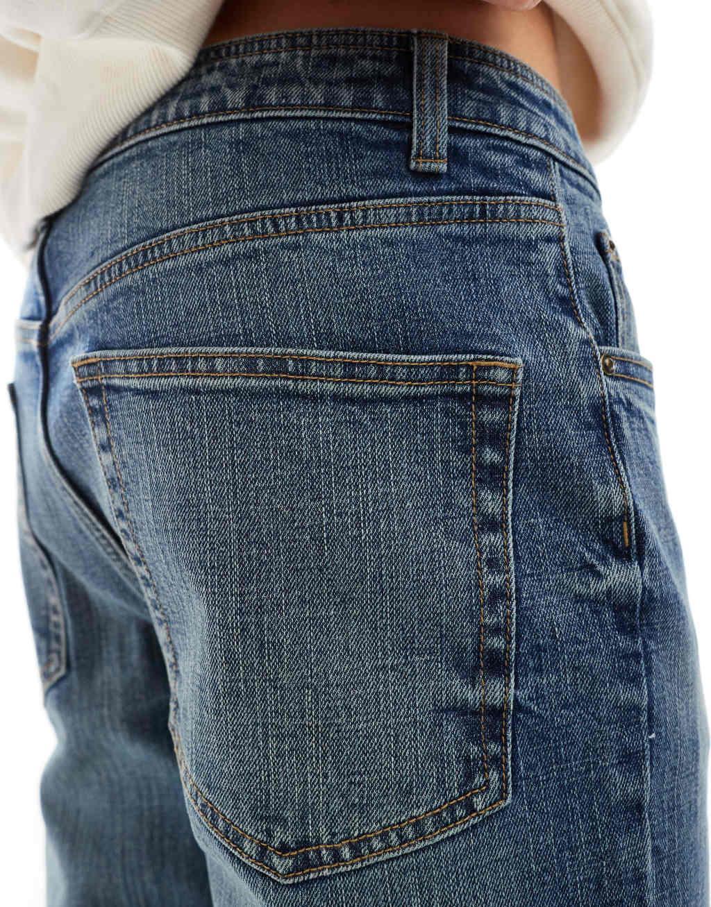 ASOS DESIGN slim jeans in mid wash blue with tint Product Image