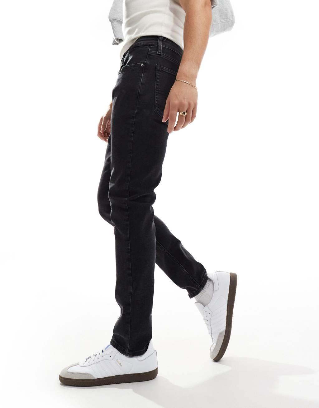 Tommy Jeans Austin slim tapered jeans in black Product Image
