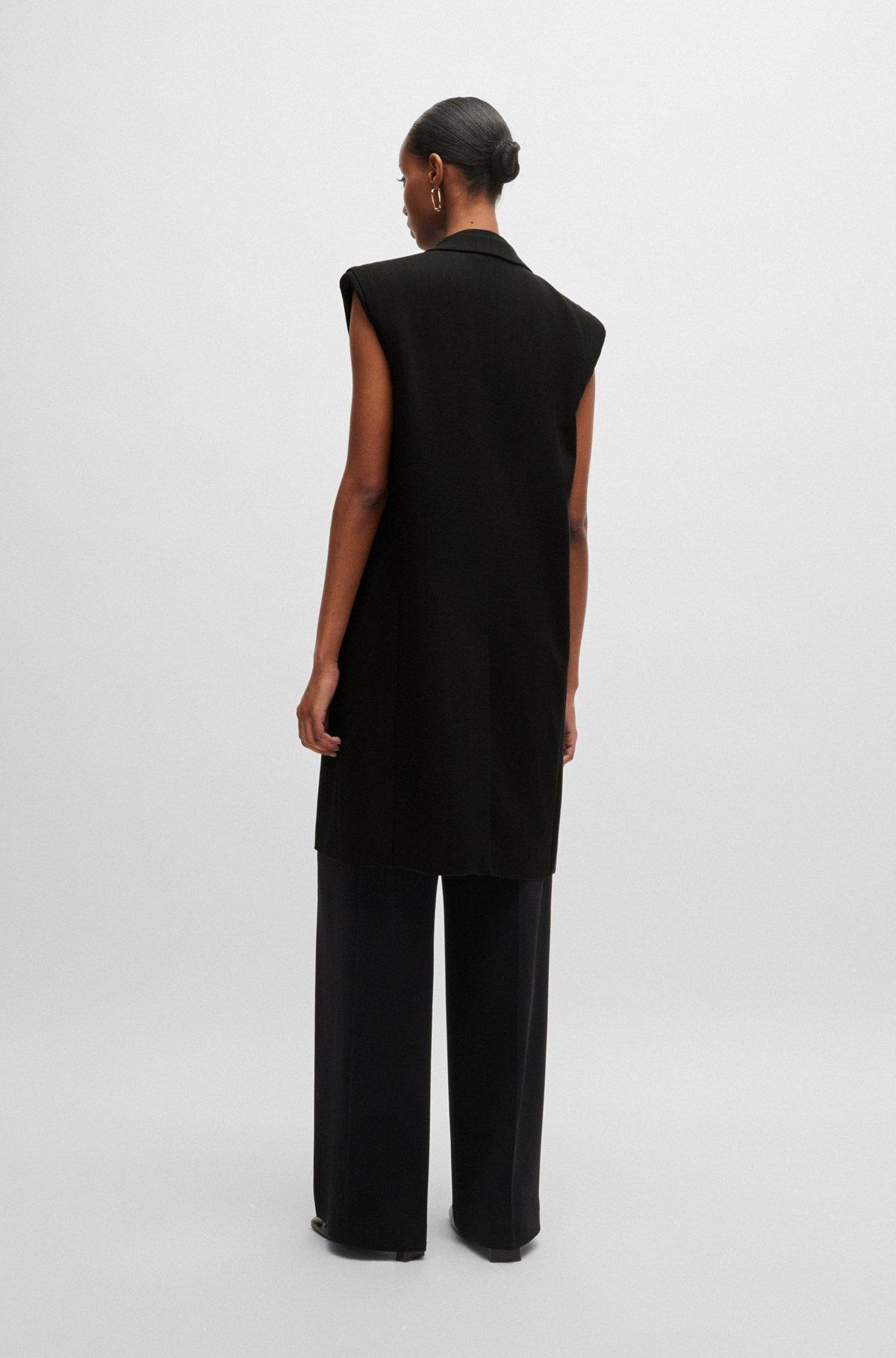 Sleeveless jacket with concealed closure and signature lining Product Image