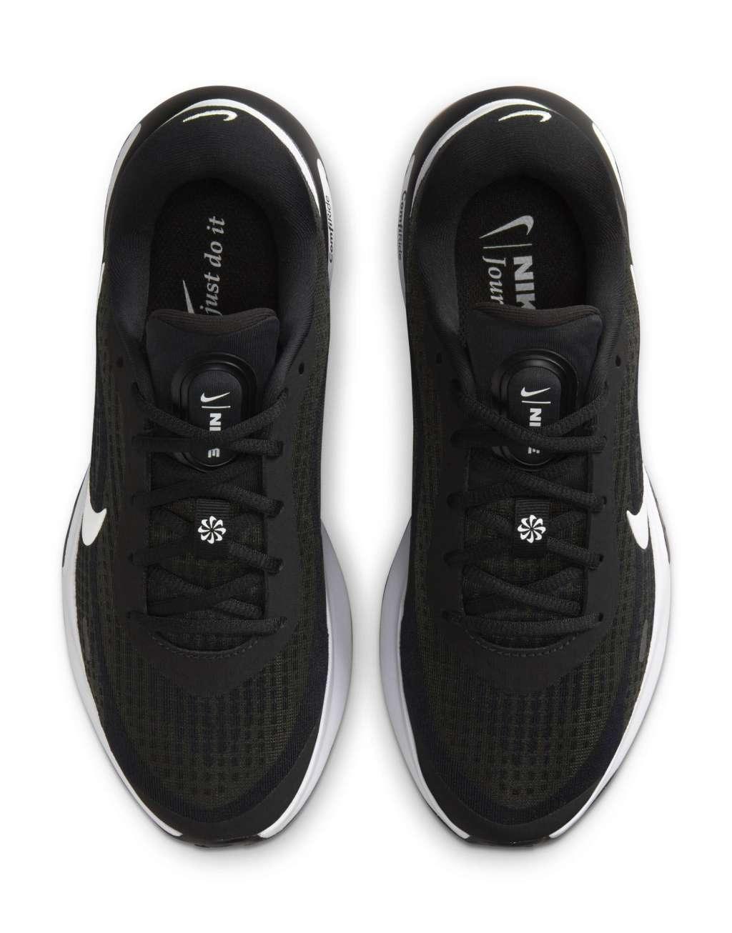 Nike Running Journey Run sneakers in black and white Product Image