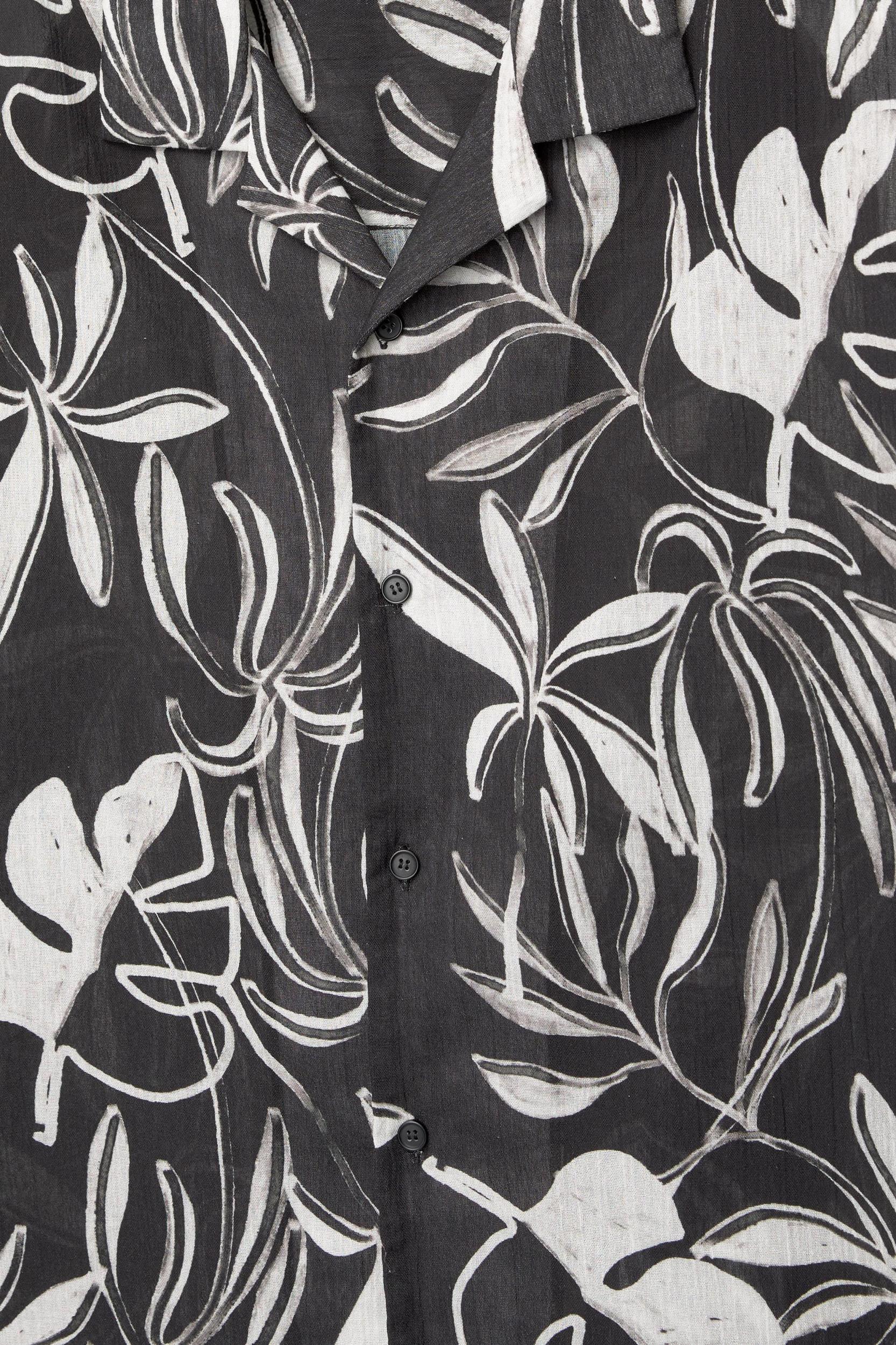 Black short sleeve shirt with leaf print Product Image