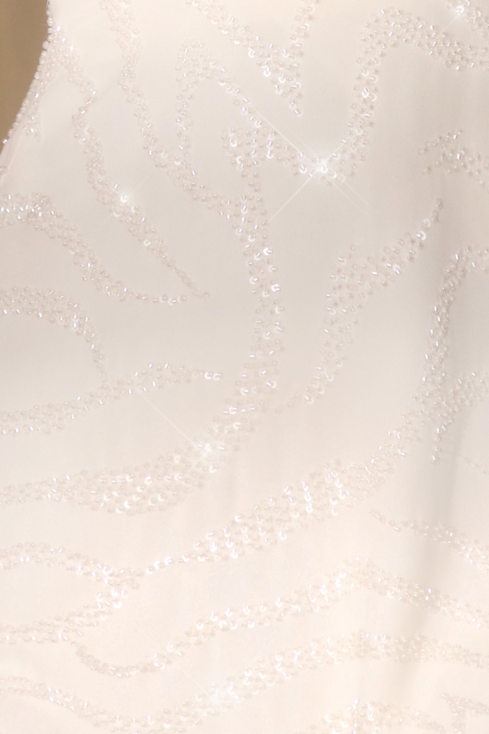 Sleeveless Wrap Over Mini Dress in Off White Product Image