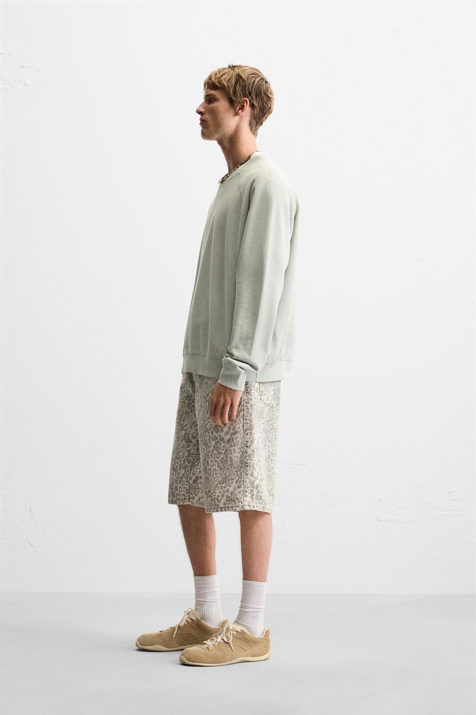 DENIM ANIMAL PRINT SHORTS Product Image