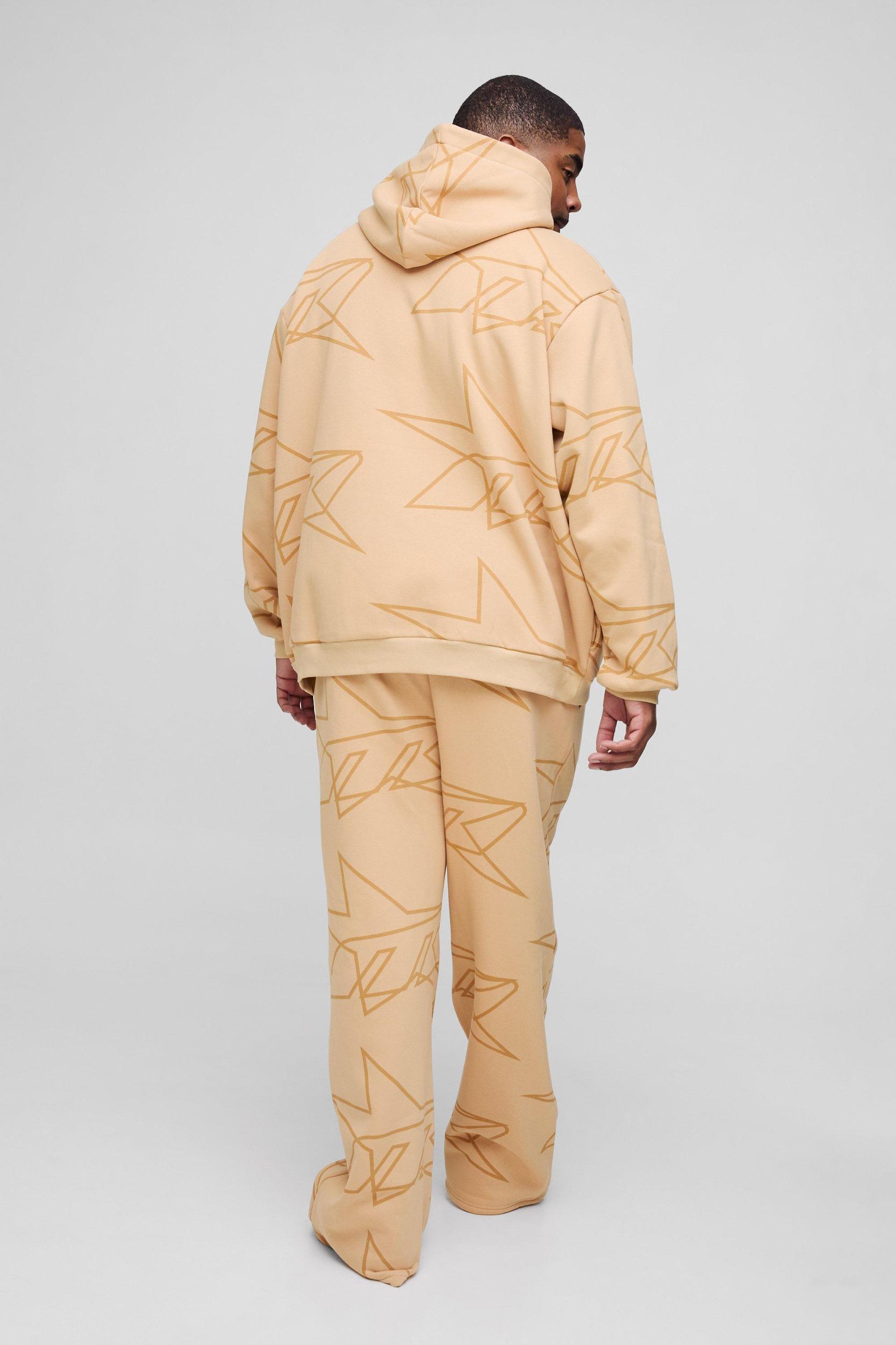 Plus Oversized Star All Over Printed Gusset Flare Hooded Tracksuit | boohooMAN USA Product Image