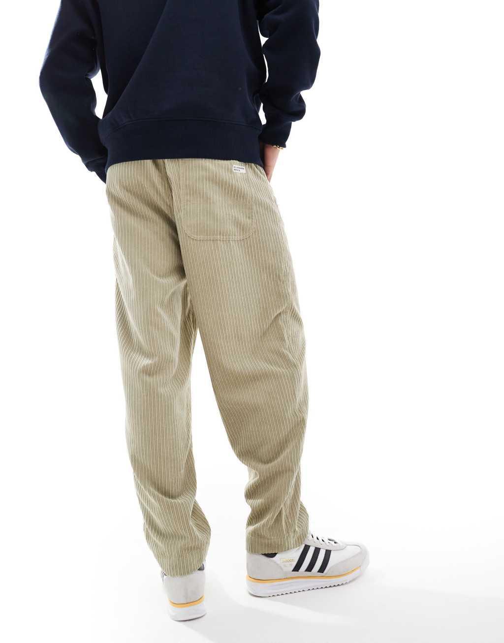 ASOS DESIGN tapered cord pants in beige  Product Image