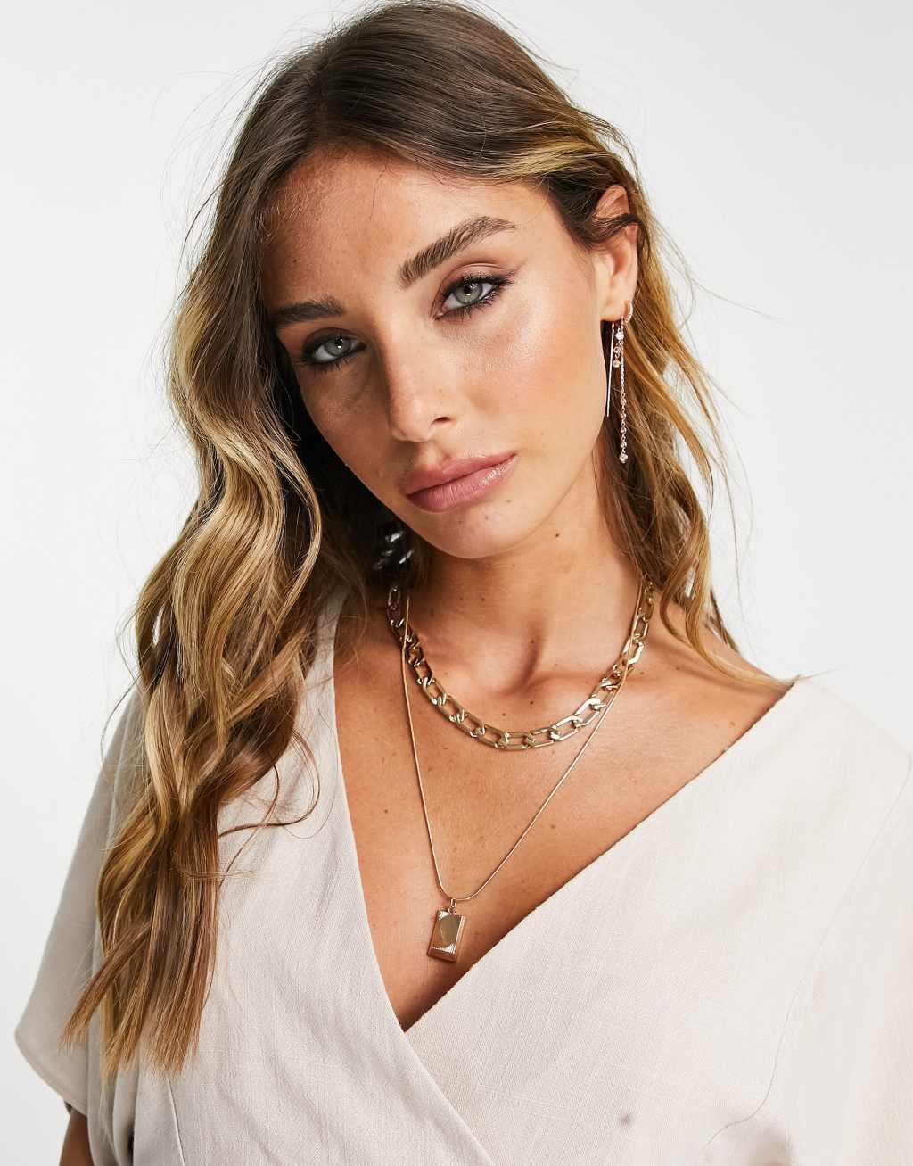 ASOS DESIGN wrap top with angel sleeve & peplum hem Product Image