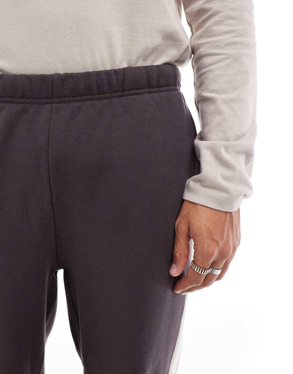 ASOS DESIGN heavyweight straight leg sweatpants with taping details in dark brown Product Image