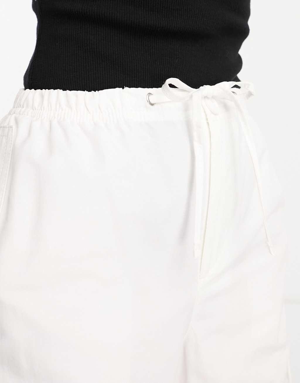 Bershka Petite tie waist nylon cargo parachute pants Product Image