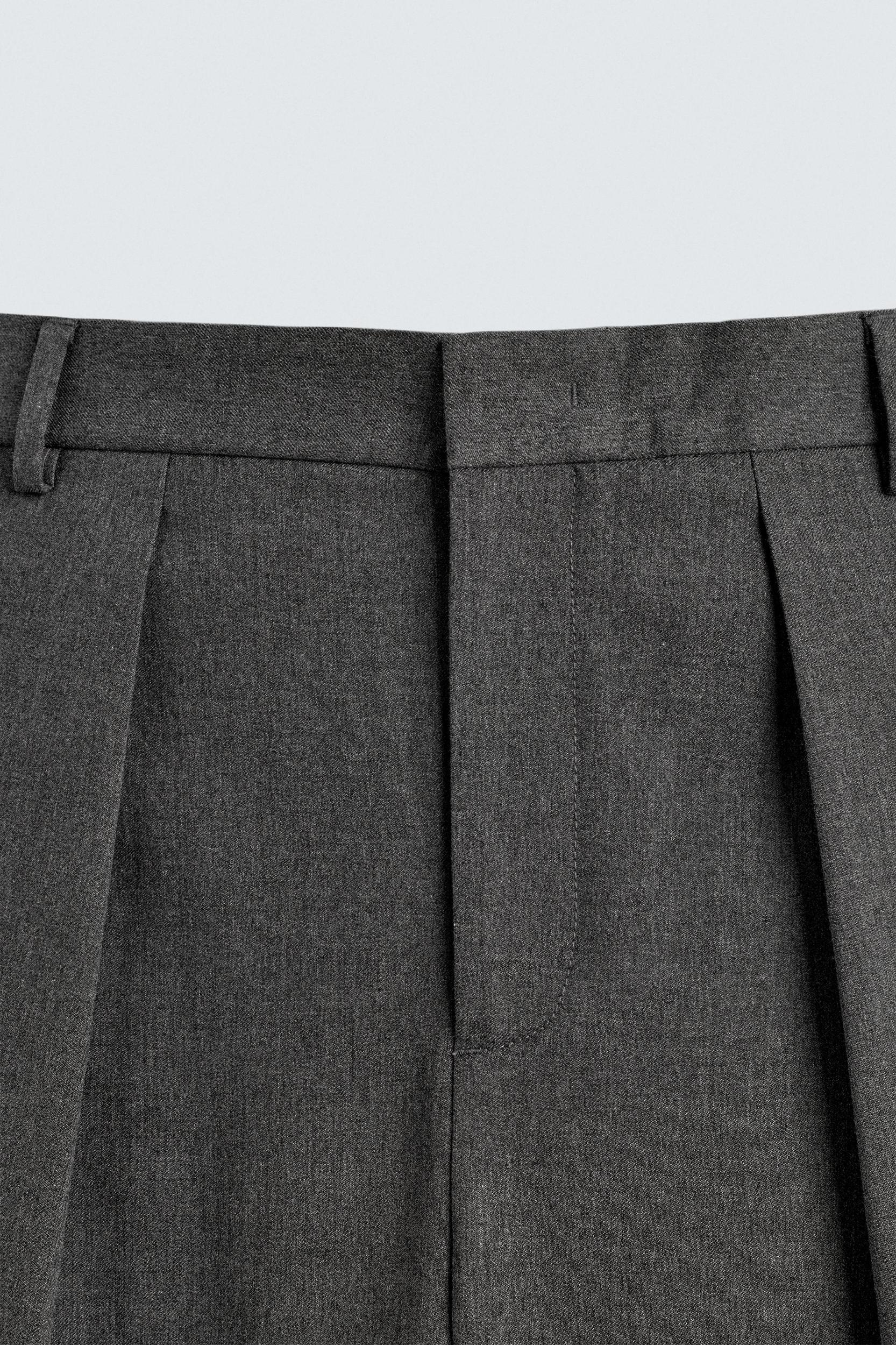 PLEATED WIDE FIT PANTS Product Image