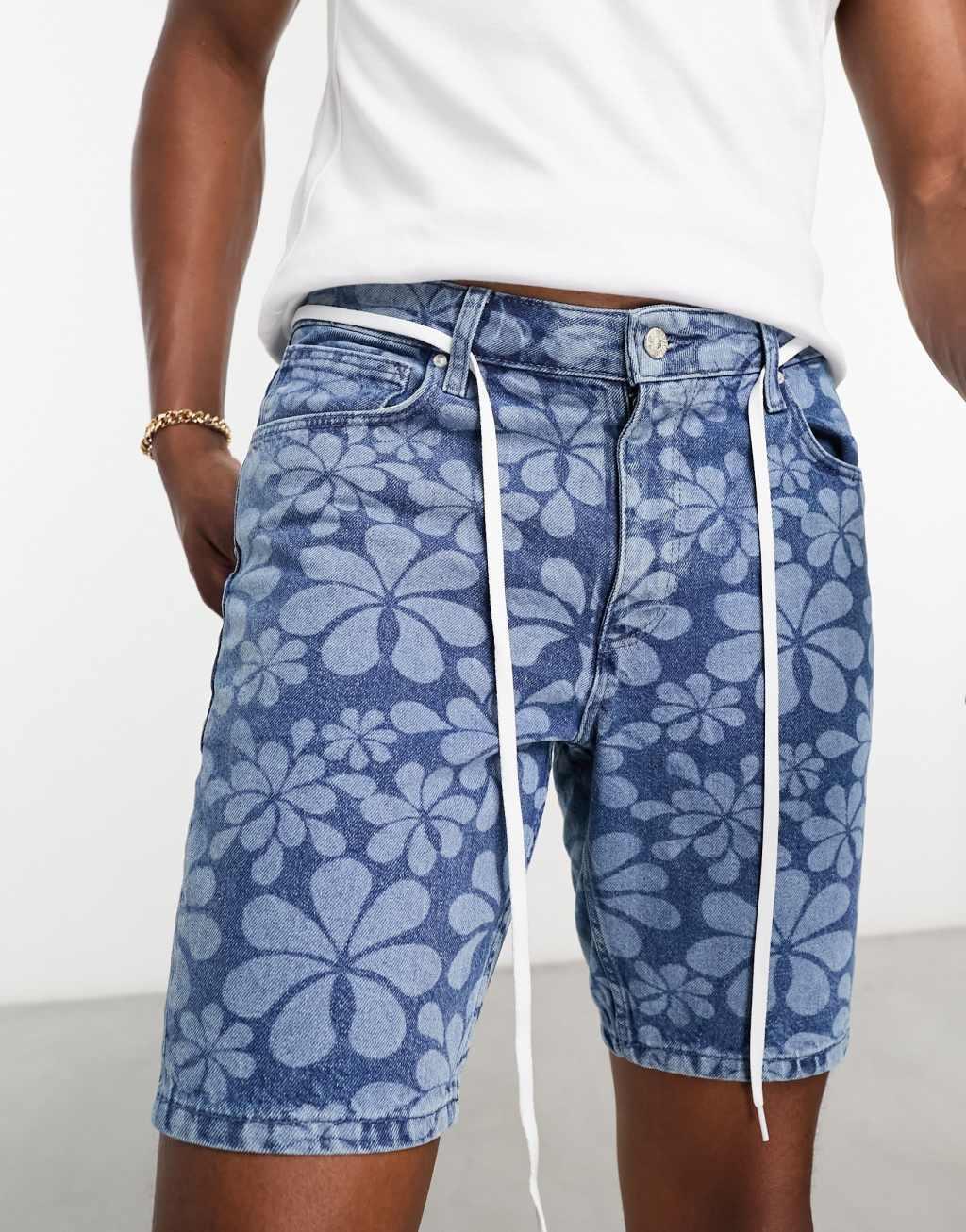 ASOS DESIGN skinny fit regular length denim shorts with flower print in mid wash blue Product Image