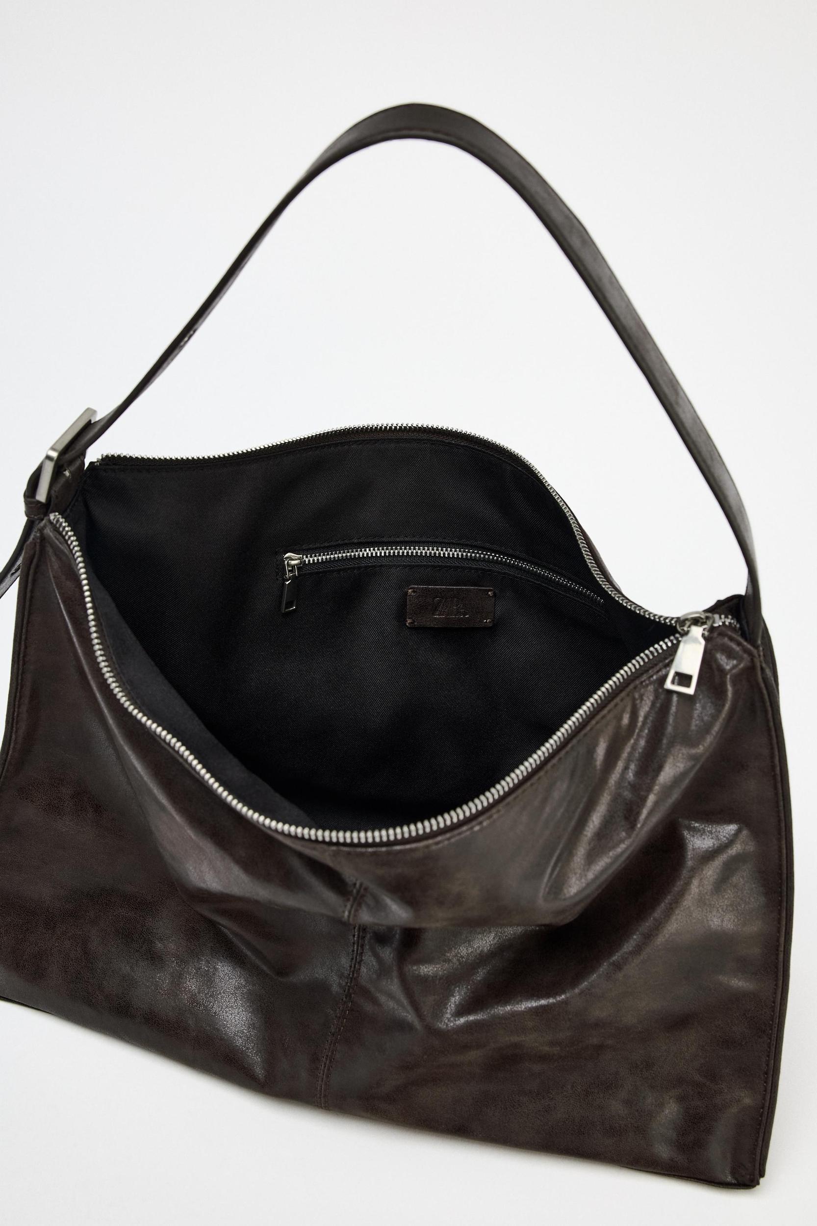 LARGE SOFT BUCKET BAG WITH METAL EYELETS Product Image