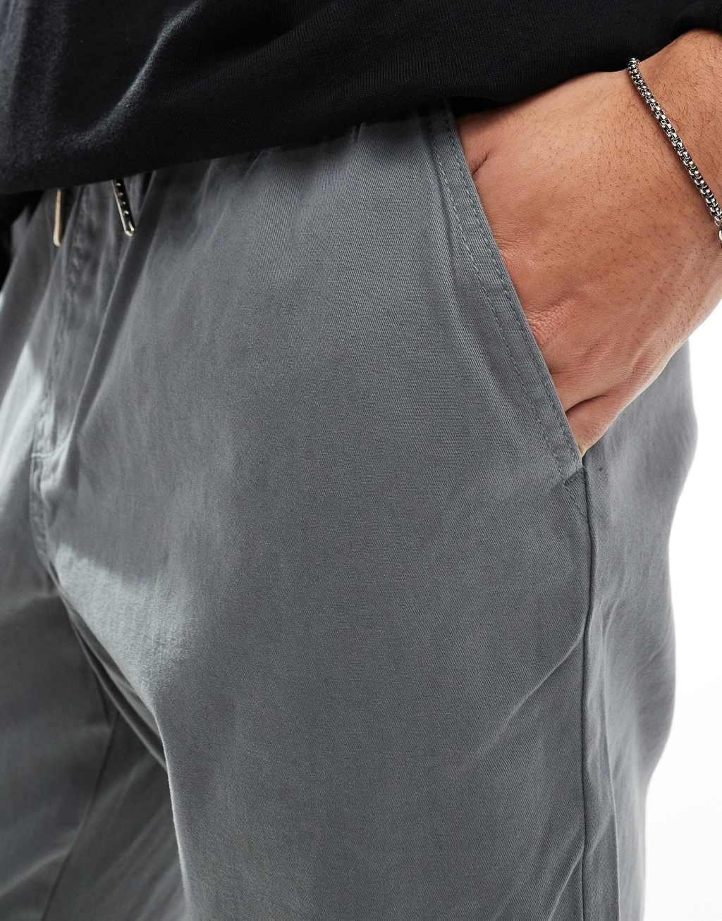 ASOS DESIGN tapered pull on pants with elastic waist in gray  Product Image