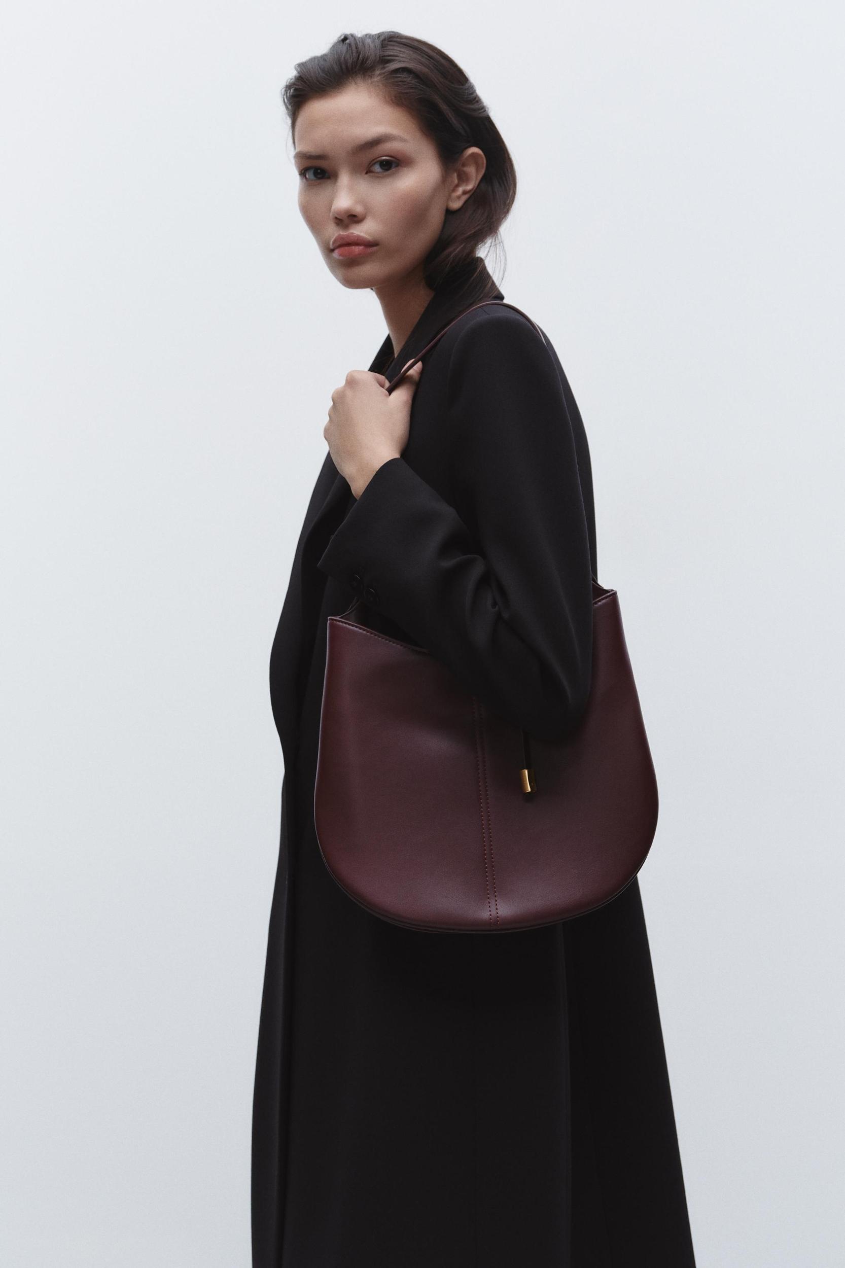 BUCKET BAG WITH PENDANT DETAIL Product Image