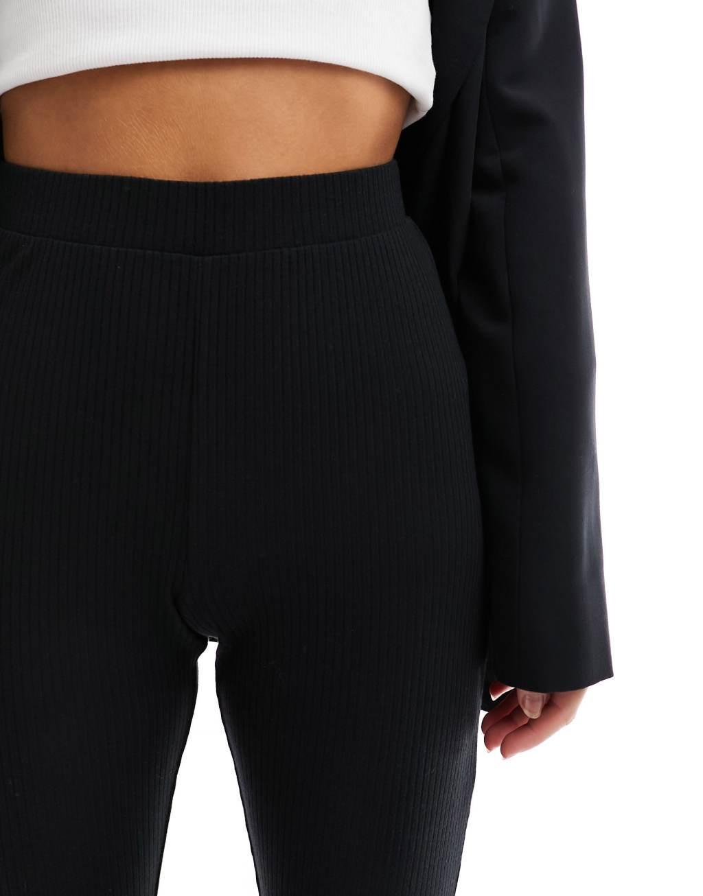 ASOS DESIGN Petite ribbed flare pants with lettuce hem Product Image